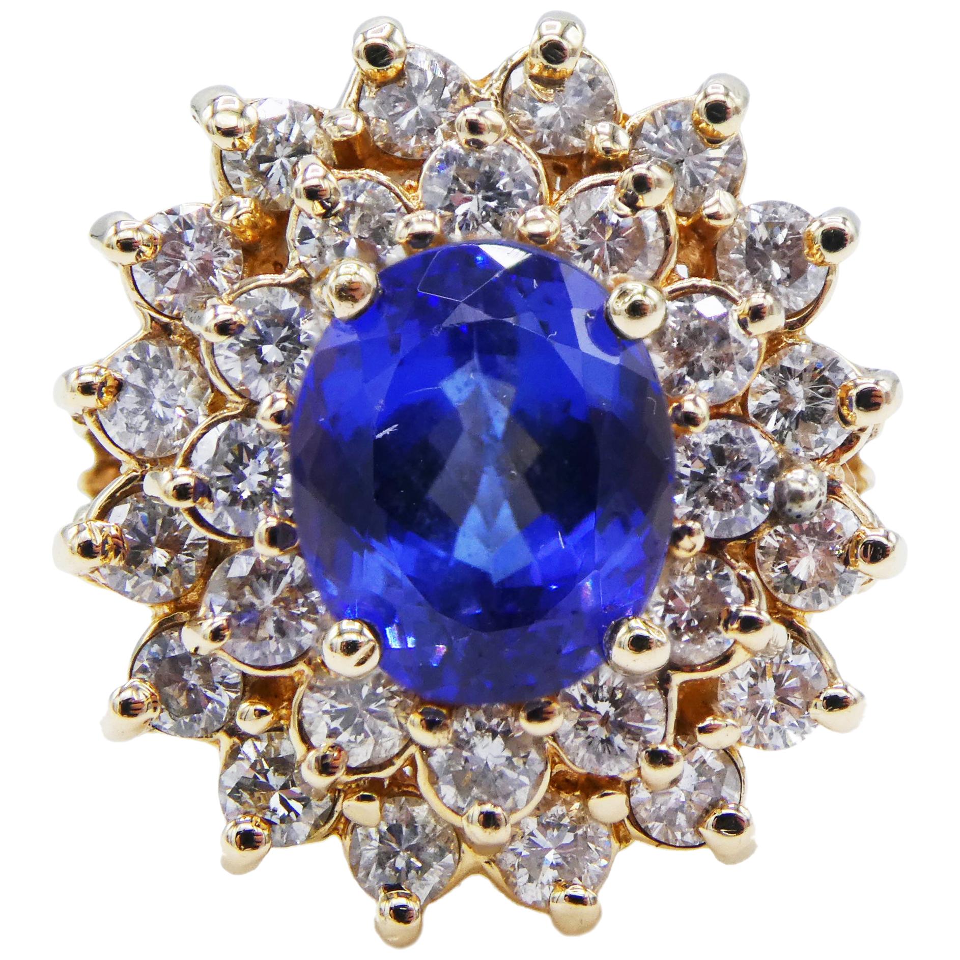 14 Karat Yellow Gold Tanzanite and Diamond Halo Cocktail Ring