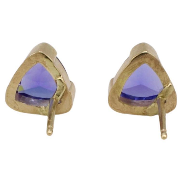 14 Karat Yellow Gold Tanzanite Trillion Shaped Stud Earrings 
Metal: 14k yellow gold
Weight: 2.40 grams
Tanzanite: 6.2 x 4.1mm trillion shape, approx. 1.60 CTW
Backs: Friction backs (posts) 
D F35000607