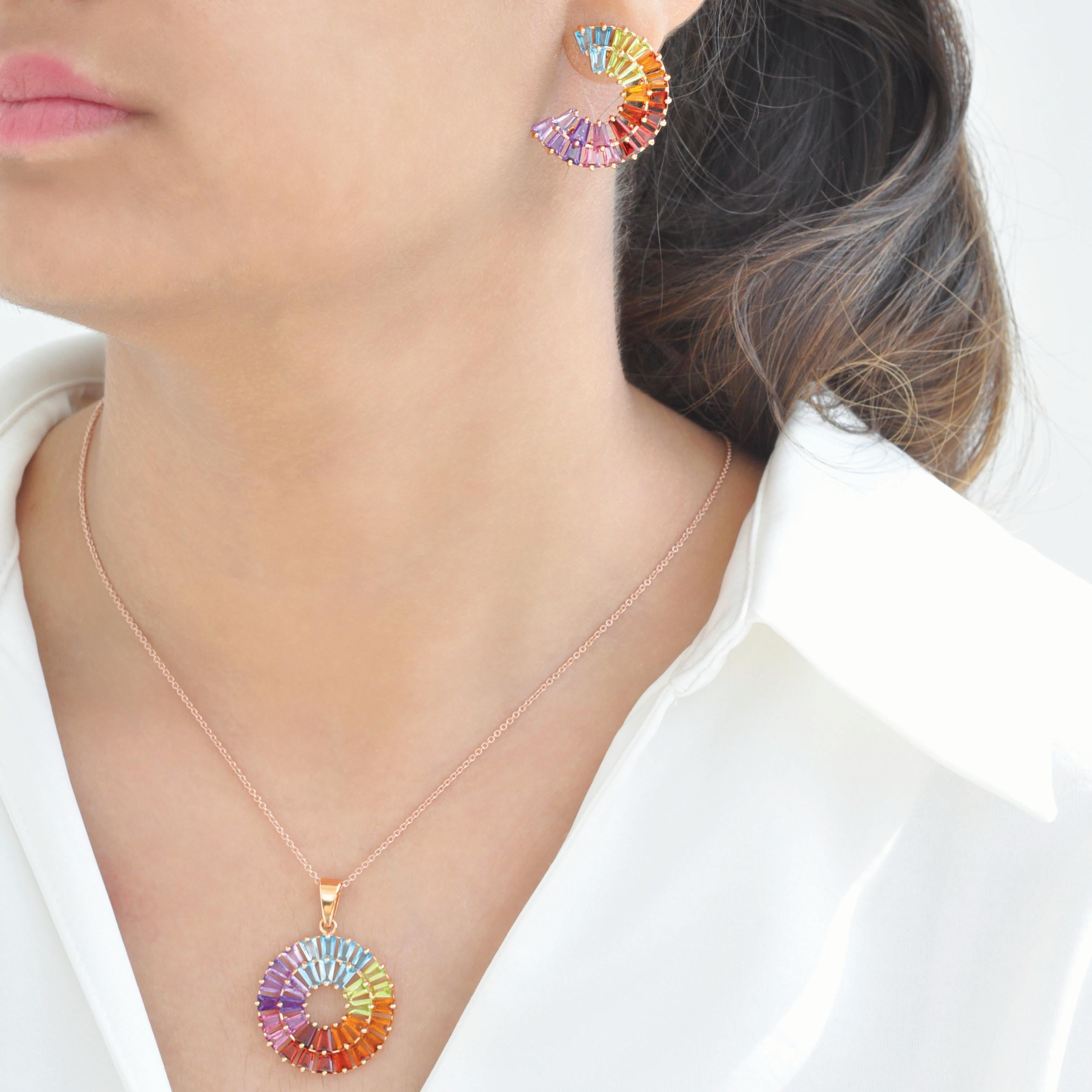 Multicolor Gemstone Three-Quarter Circle Earrings & Pendant in 14K Yellow Gold

Celebrate the vibrant beauty of nature’s colors with this exquisite matching set, featuring a pendant and stud earrings crafted in radiant 14-karat yellow gold. Designed