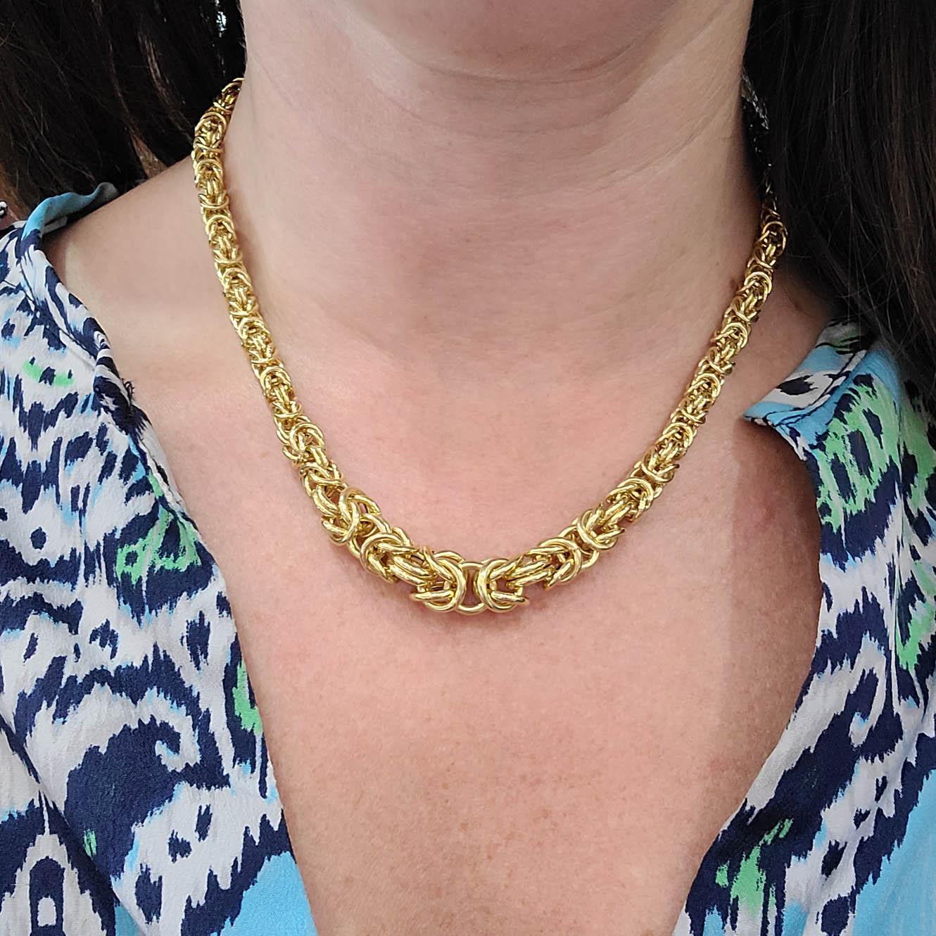 14 Karat Yellow Gold Tapered Byzantine Chain Necklace Measuring 16 Inches Long. Lobster Clasp Closure. Finished Weight is 24 Grams.