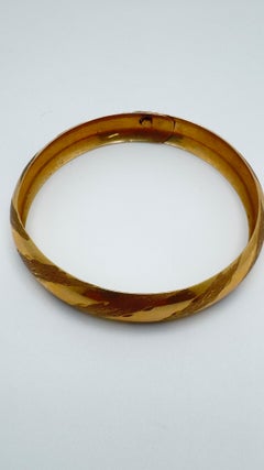 14 Karat Yellow Gold, Tension Lock Hidden Clasp, Diamond Cut Bangle