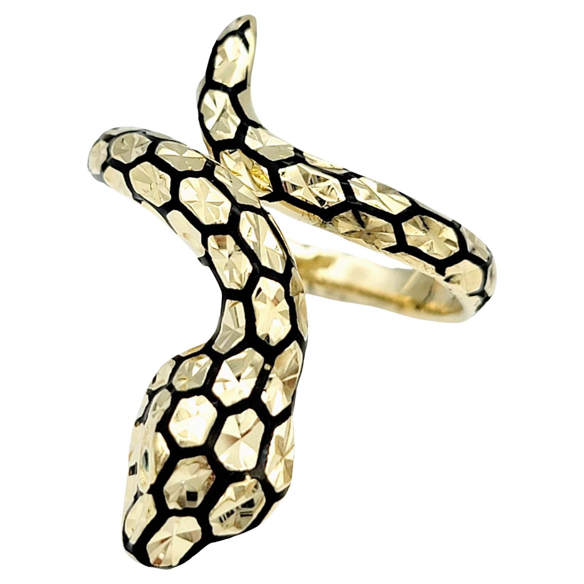 Ring is approximately a size 10. 

This 14 karat gold bypass ring is a true marvel of artistry, exuding a sense of mystique and bold elegance. Crafted in the shape of a sinuous snake, it beautifully combines elements of nature and