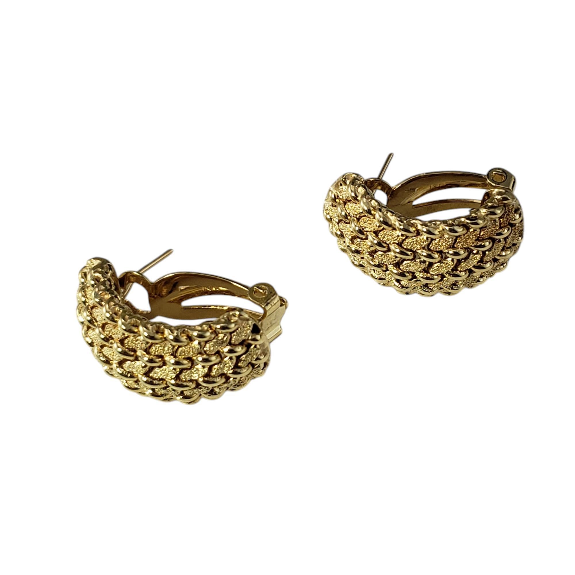 14 Karat Yellow Gold Textured Weave Half Hoop Earrings

These elegant earrings feature a timeless half-hoop design crafted in 14K yellow gold. The surface showcases a stunning textured weave pattern, adding depth and sophistication to the piece.