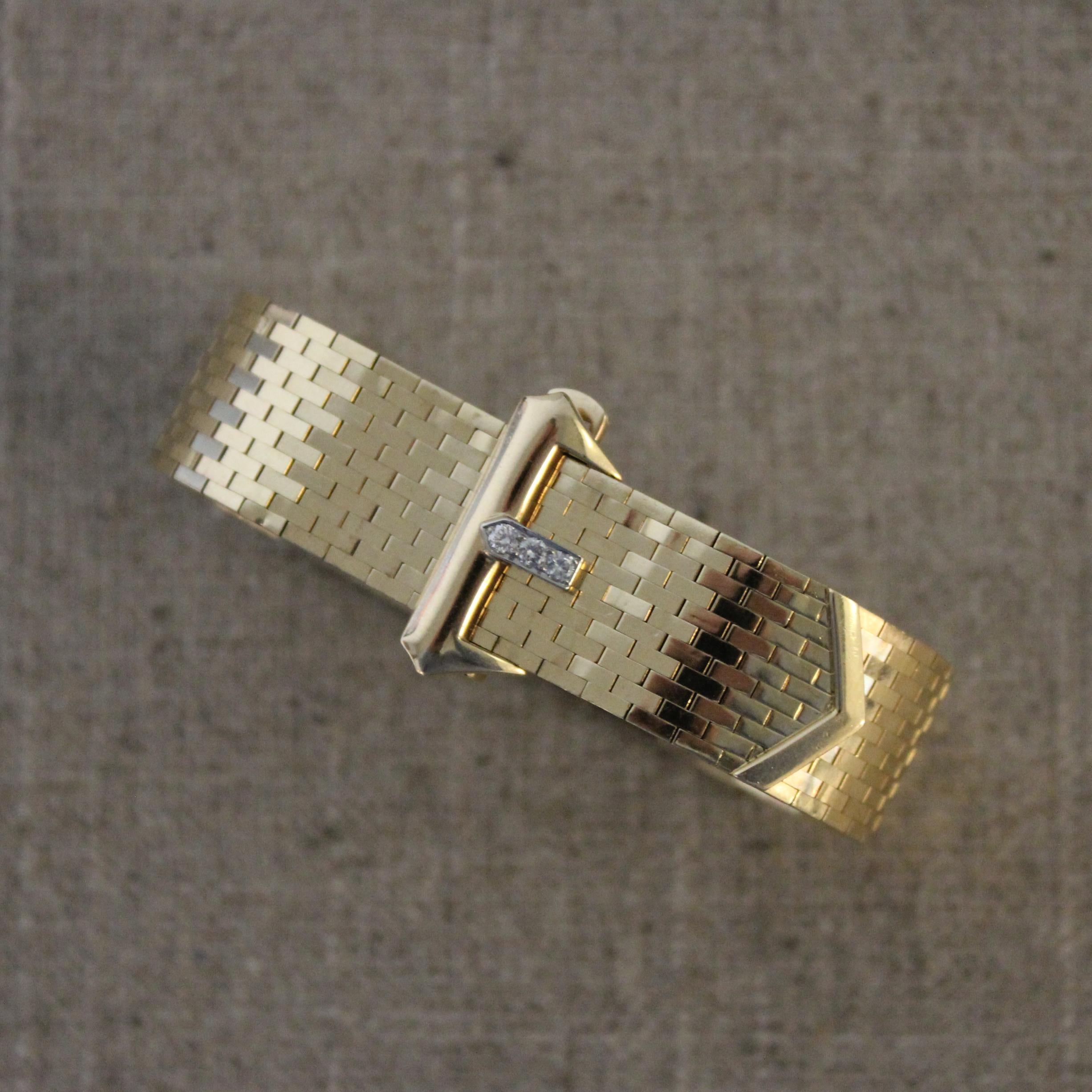 14 karat yellow gold Tiffany diamond Buckle bracelet. The bracelet is a soft gold mesh with flexibility featuring an adjustable diamond buckle clasp to fit perfectly to your wrist. The diamonds on the buckle weigh a total of .10 carats. 