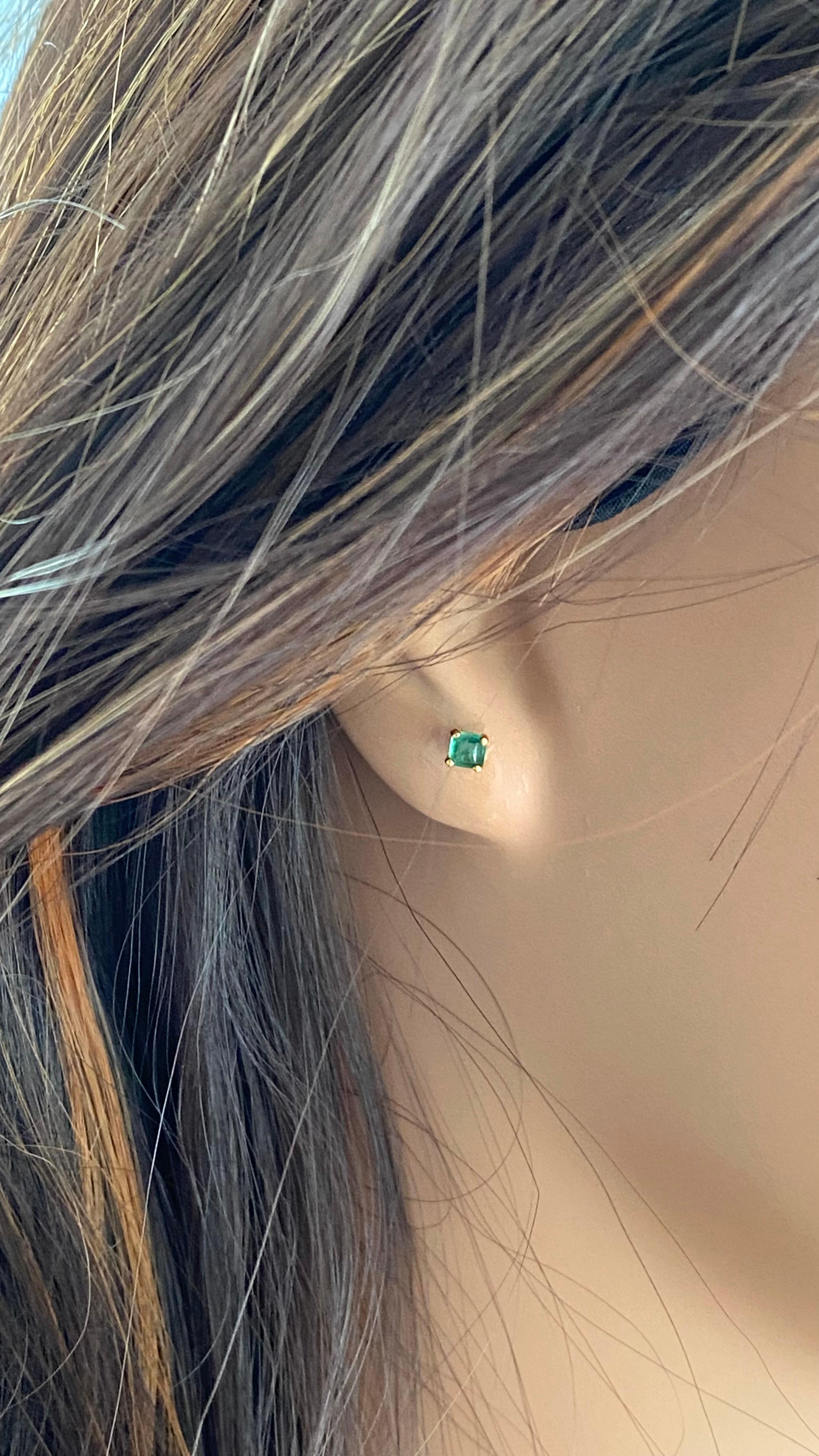 Introducing our exquisite 14 karat yellow gold Tiny Square Cabochon Emerald Stud Earrings, the epitome of elegance and sophistication. Crafted with precision and care, these delicate earrings are designed to adorn your second or third earlobe