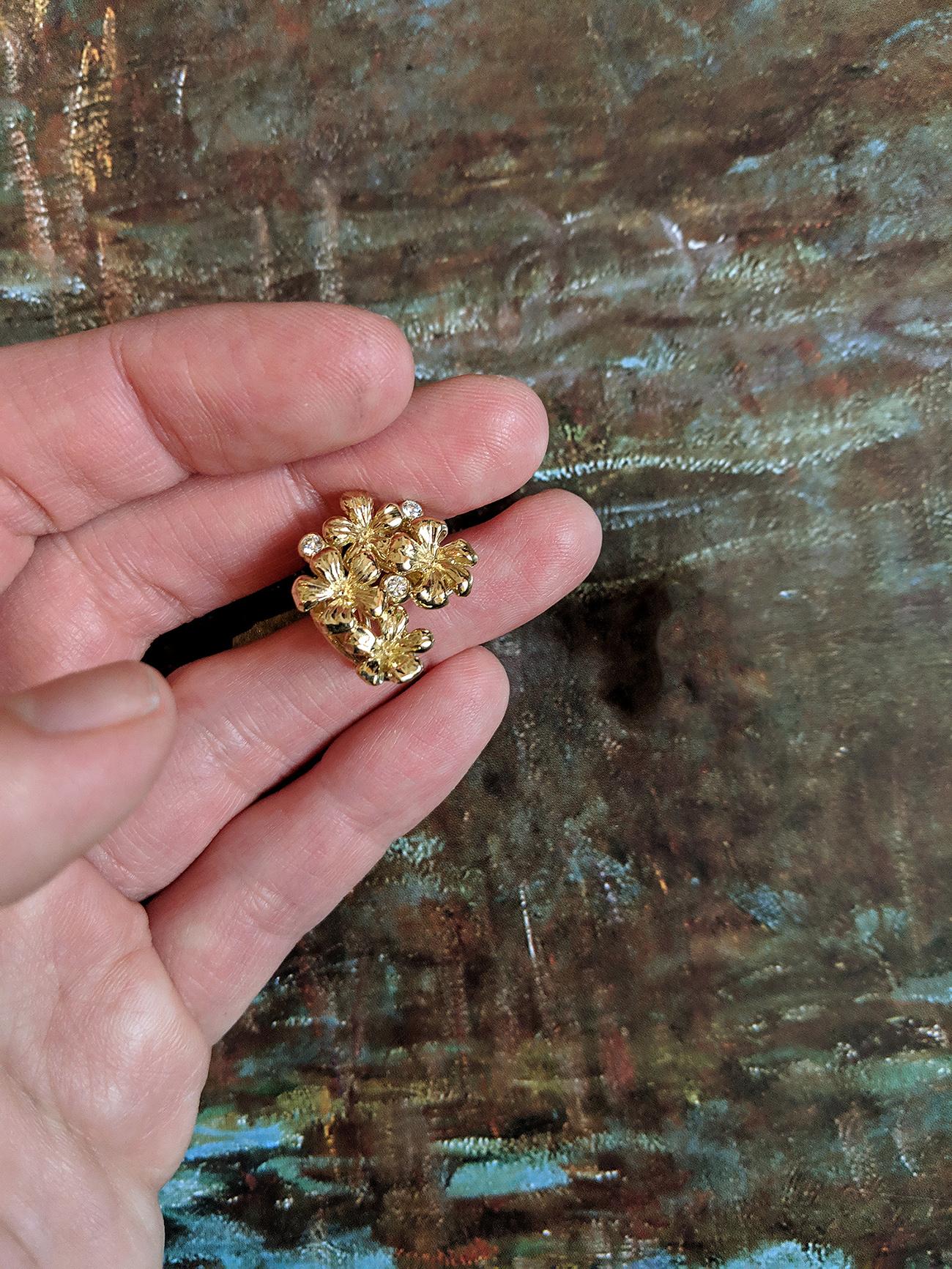 14 karat yellow gold Plum Blossom brooch with a removable lemon quartz drop, encrusted with 3 round diamonds, is a contemporary jewellery piece that has been featured in Vogue UA reviews. The cabochon lemon quartz can be easily replaced with other
