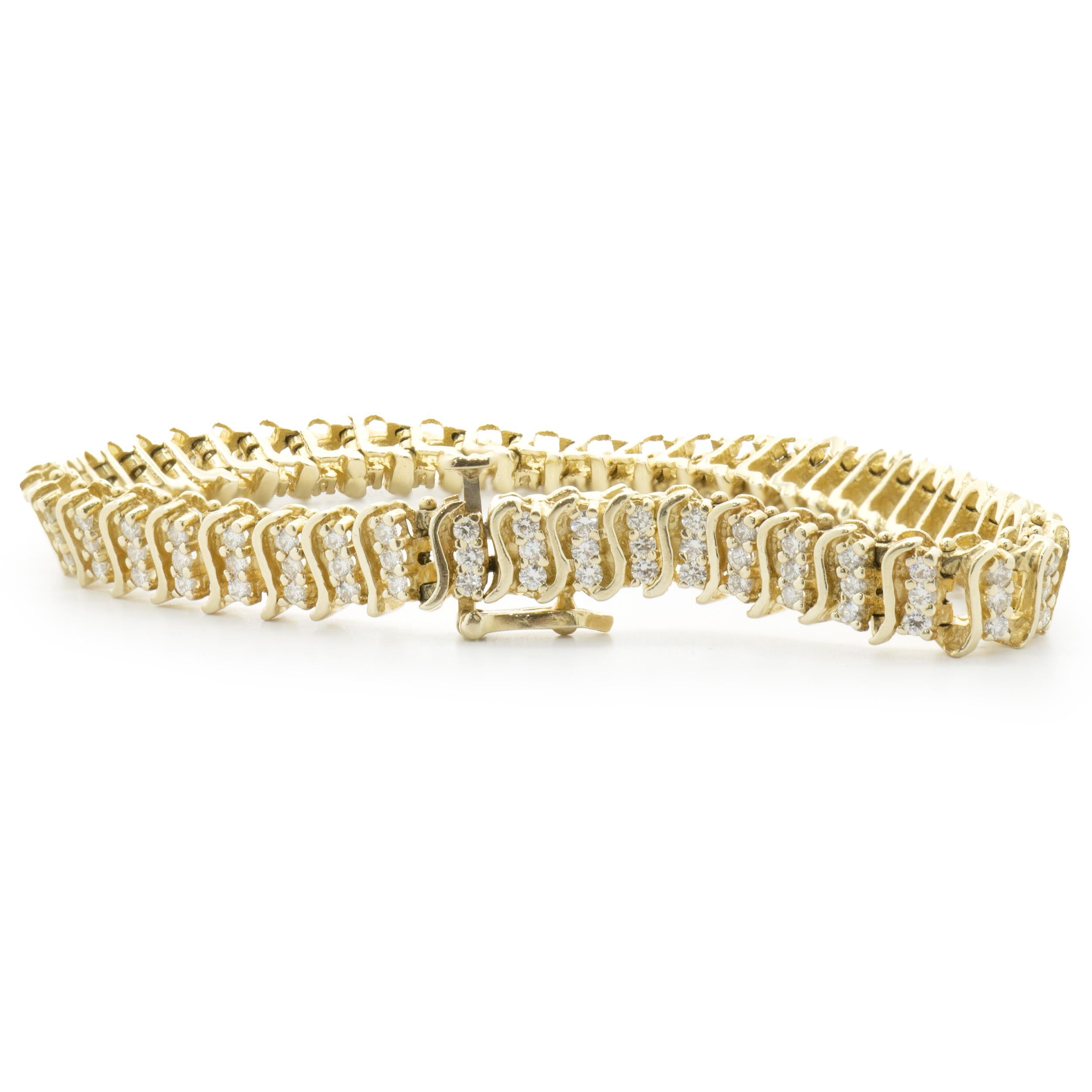 Designer: custom design
Material: 14K yellow gold
Diamond: 141 round brilliant cut = 2.82cttw
Color: H
Clarity: SI1
Dimensions: bracelet will fit up to a 7-inch wrist
Weight: 16.42 grams