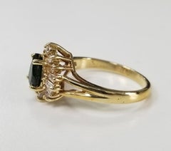 Anello in oro giallo 14 carati con tsavorite e diamanti