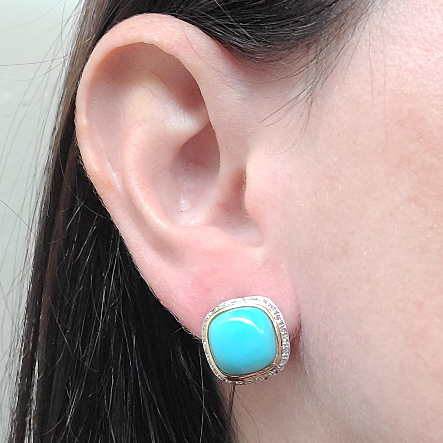 14 Karat Yellow Gold Pair Of Stud Earrings Featuring 2 Bezel Set Cushion Cut Cabochon Turquoise Surrounded By 52 Round Brilliant Cut Diamonds Totaling Approximately 0.26 Carats. Pierced Post With Omega Clip Back. Post Can Be Removed Upon Request.