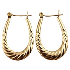 14 Karat Yellow Gold Twist Cable Oval Hoop Earrings #18782