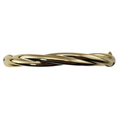 14 Karat Yellow Gold Twist Hinged Bangle Bracelet