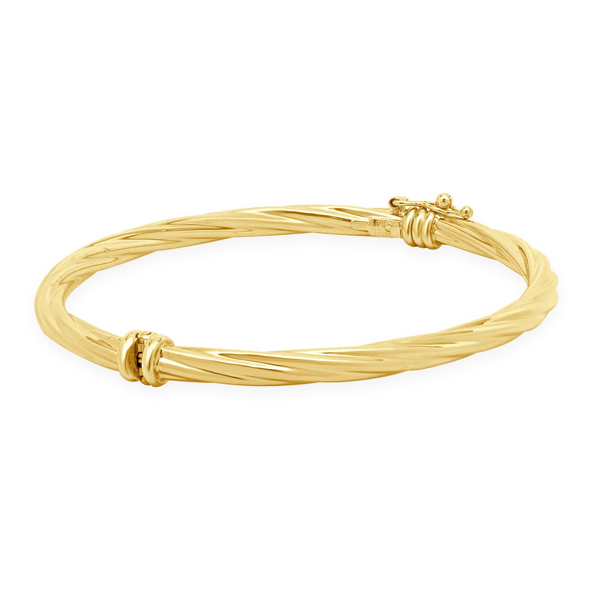 Material: 14K yellow gold
Dimensions: bracelet will fit up to a 7-inch wrist
Weight: 5.47 grams
