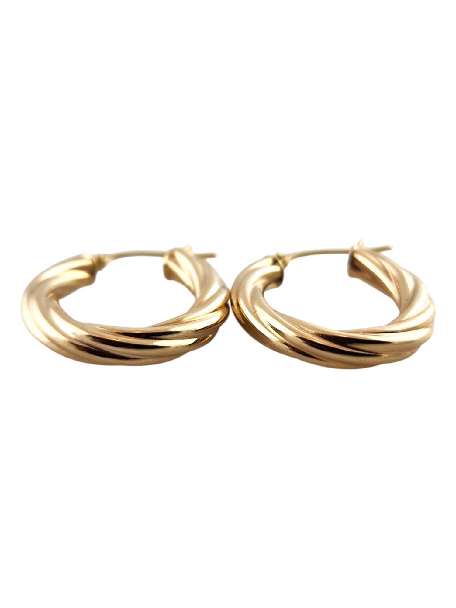 14 Karat Yellow Gold Twisted Hoop Earrings

These beautiful 14K yellow gold hoops are in a gorgeous, twisted pattern!

Size: 25.35mm X 21.4mm X 3.80mm

Weight: 2.35 g/ 1.52 dwt

Hallmark: 14KT ITALY RCI

Very good condition, professionally