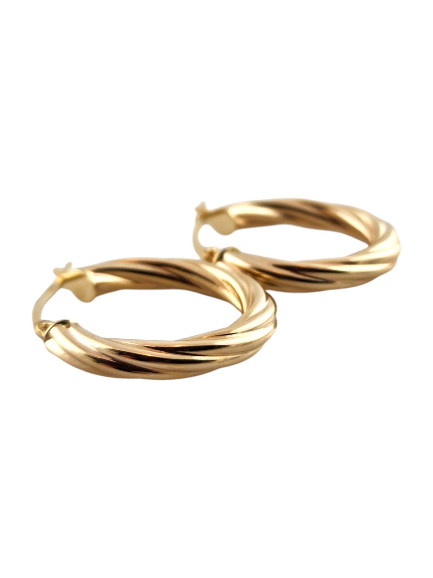 Women's 14 Karat Yellow Gold Twisted Hoop Earrings #19150