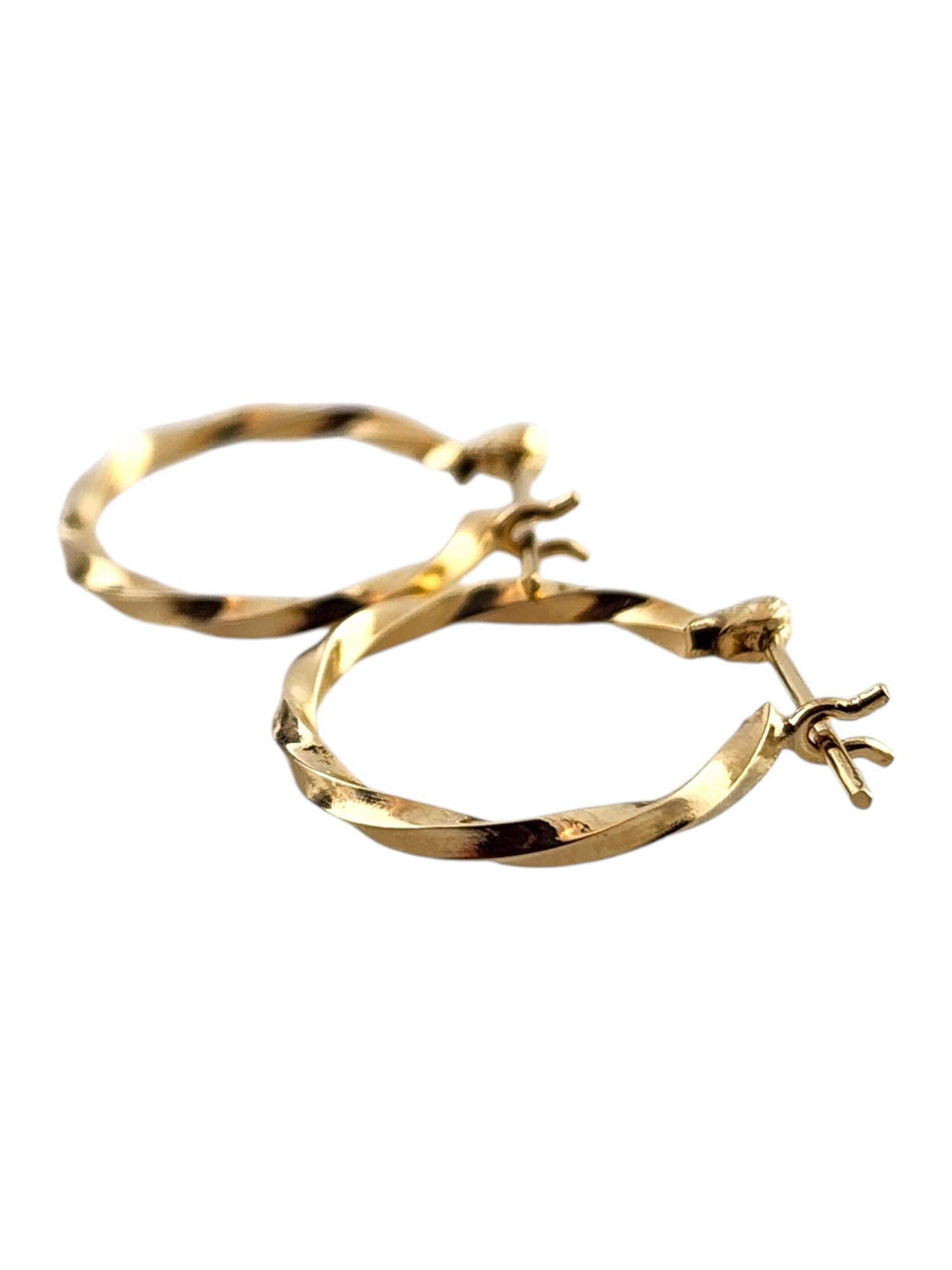 Women's 14 Karat Yellow Gold Twisted Hoop Earrings #19154 For Sale
