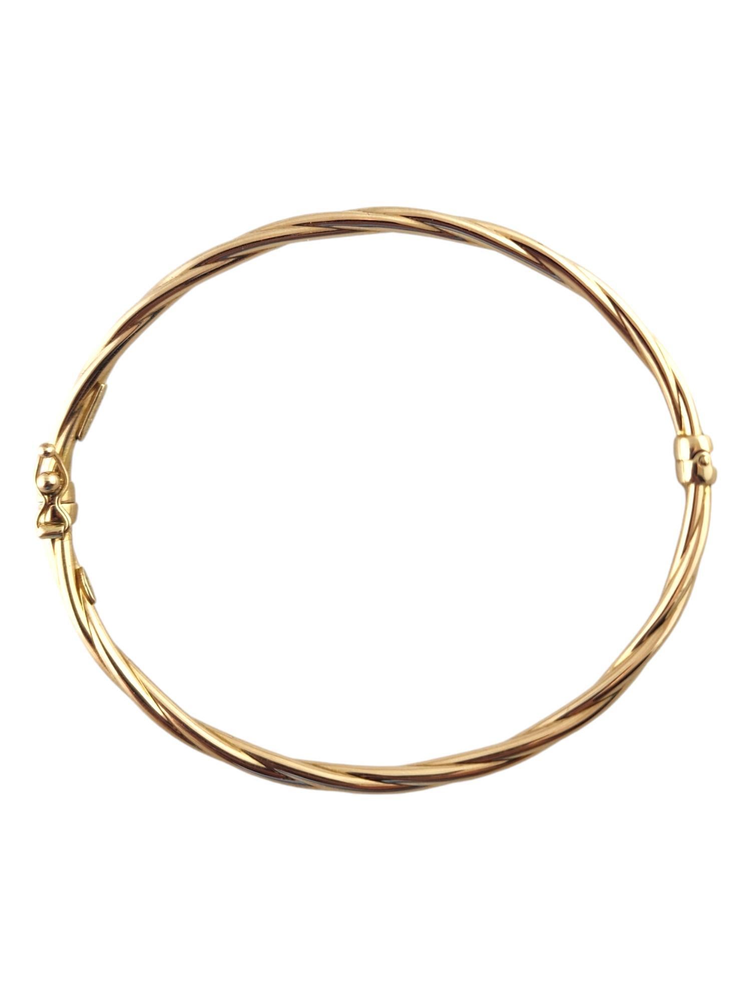 14 Karat Yellow Gold Twisted Oval Bangle Bracelet

This stunning bangle bracelet was crafted from 14K yellow gold in a beautiful, twisted pattern that will look amazing on anyone!

Approximate inside measurements: 2 1/2