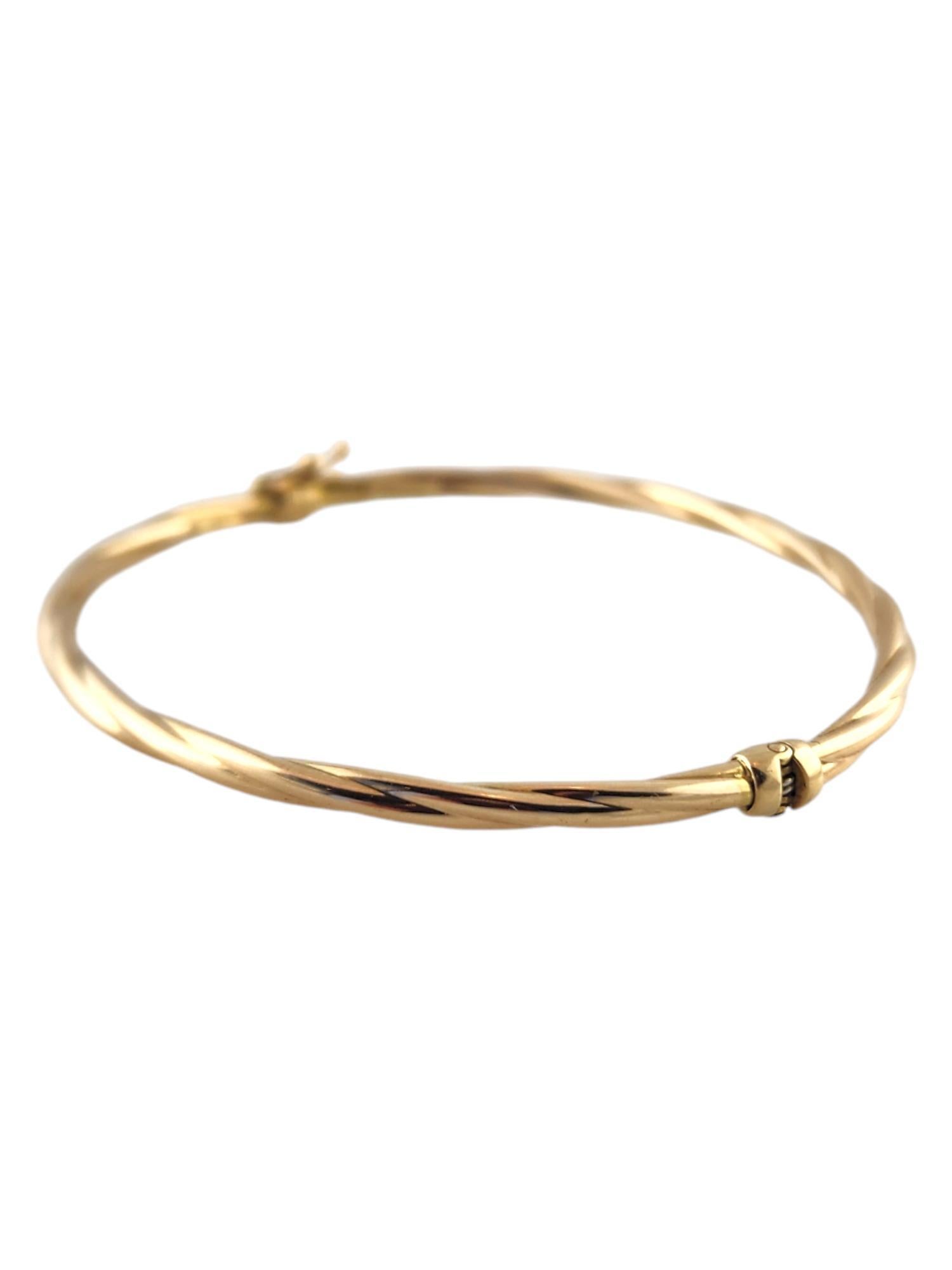 Women's 14 Karat Yellow Gold Twisted Oval Bangle Bracelet #19007
