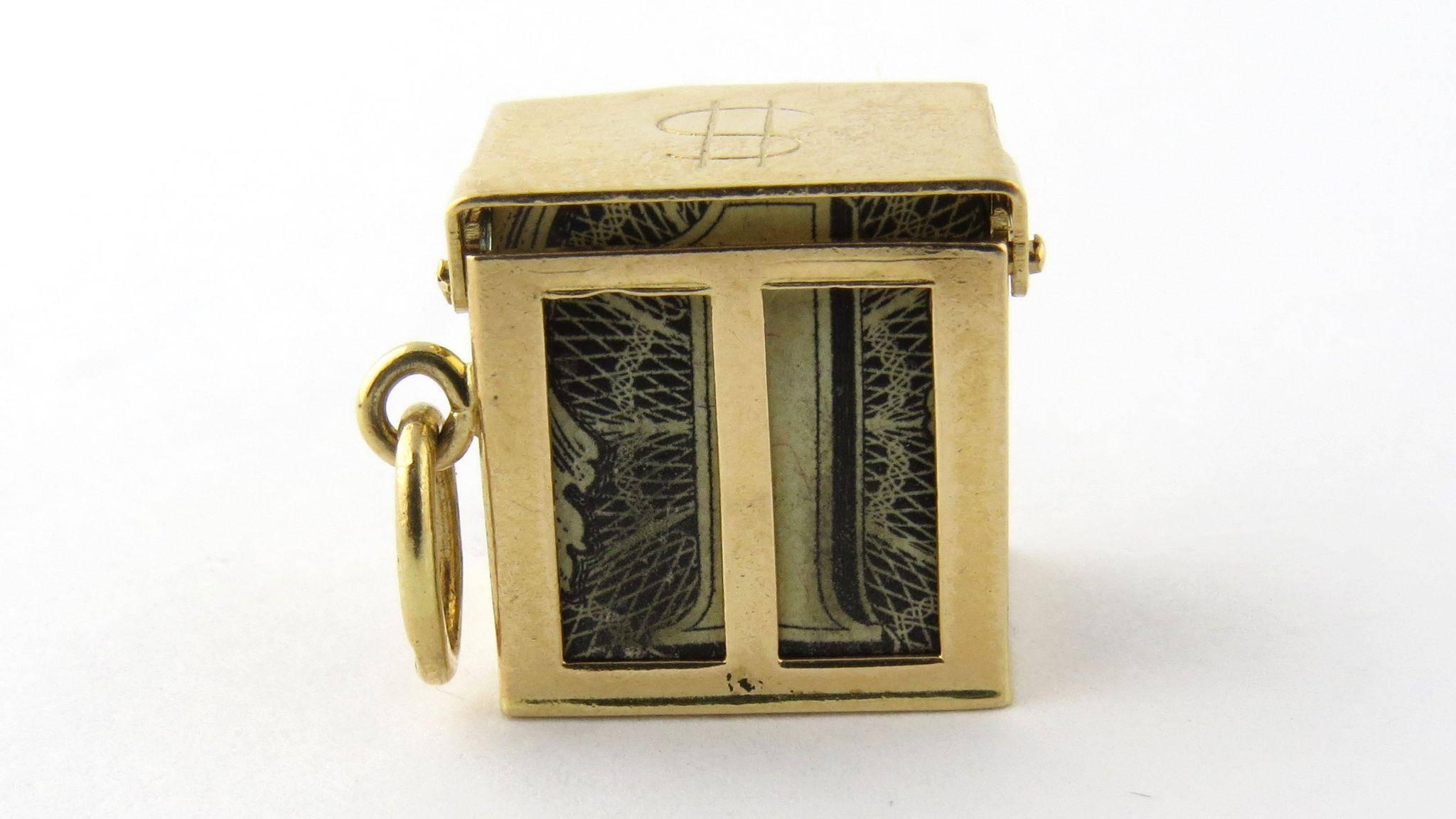 Vintage 14K yellow gold mad money charm. 

Accordion folded United States $1 filled gold charm will get you out of any monetary jam! Open on all sides with lifting latched top and $ sign engraved. 

Marked: 14K Measures: 13mm squared. Weighs: 3.5g,