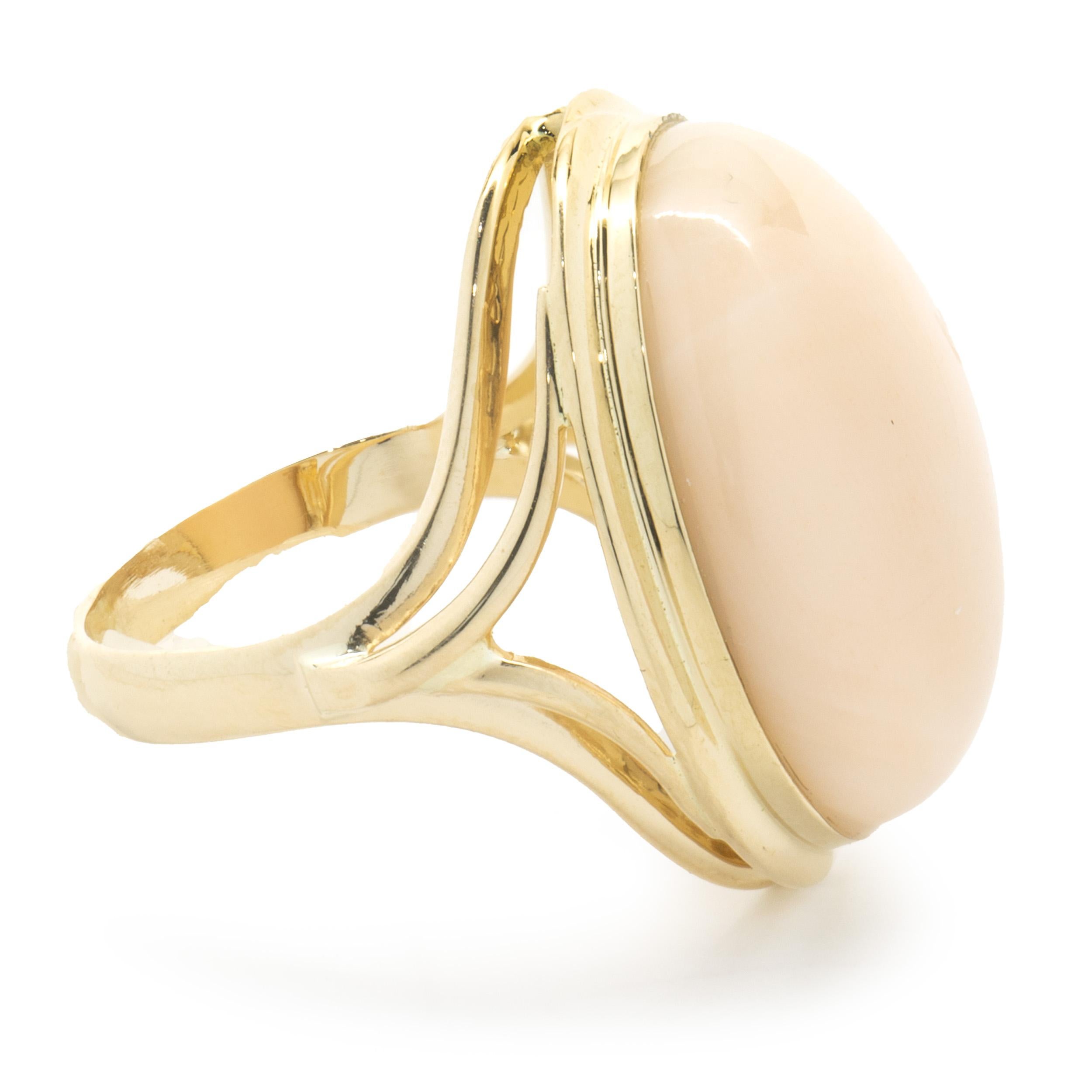 Oval Cut 14 Karat Yellow Gold Vintage Angle Skin Coral Ring For Sale