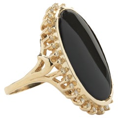 14 Karat Yellow Gold Vintage Black Onyx and Diamond Halo Ring