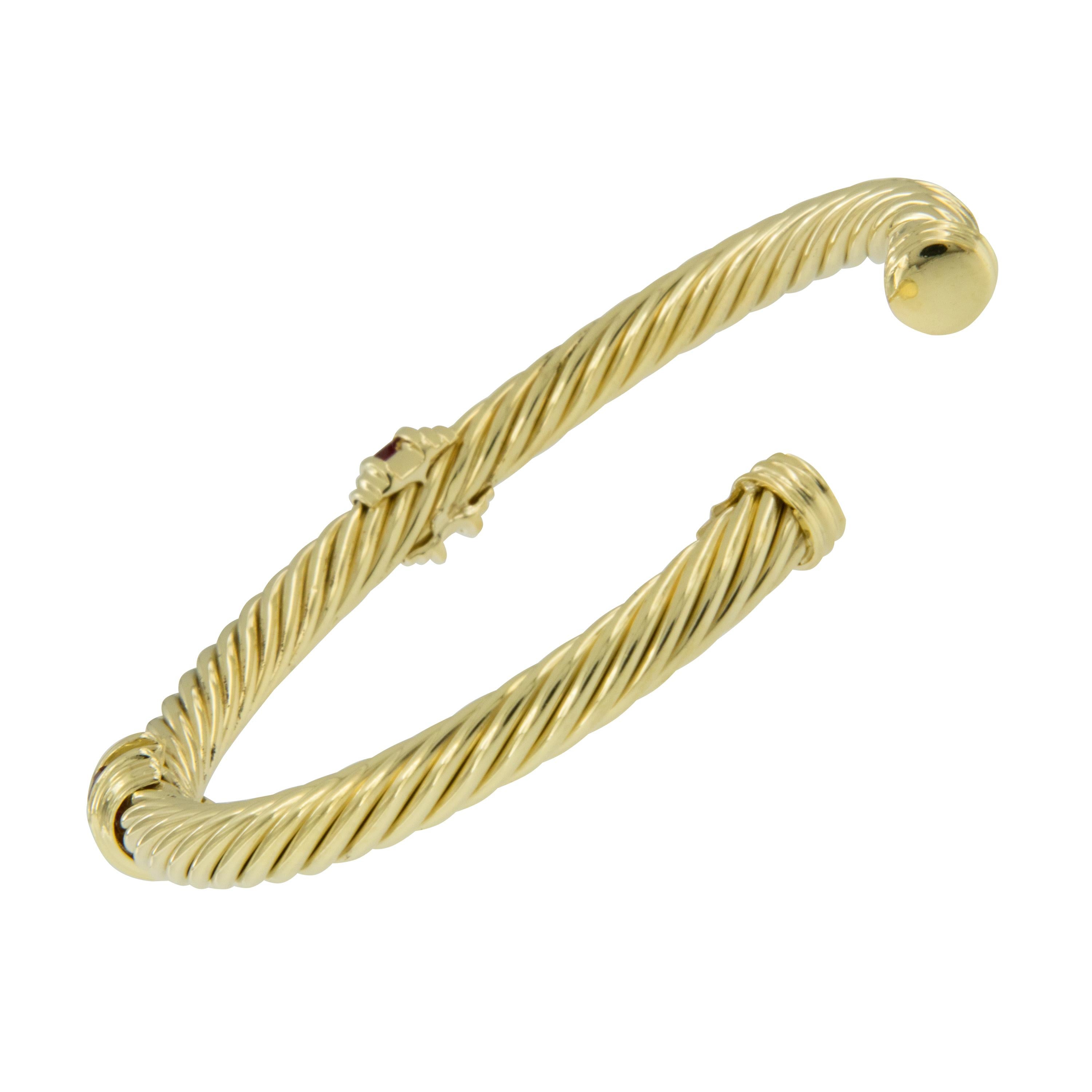 Timeless David Yurman design cable spira cuff bracelet with double square cut ruby stations. This bracelet looks fantastic on your wrist alone or stacked . Cuff style bangle is convenient for ease of on & off your wrist. Complimentary signature