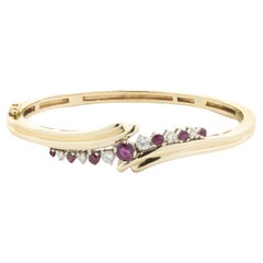 14 Karat Yellow Gold Vintage Diamond and Ruby Bypass Bracelet