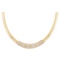 Collana Omega con diamanti vintage in oro giallo 14 carati