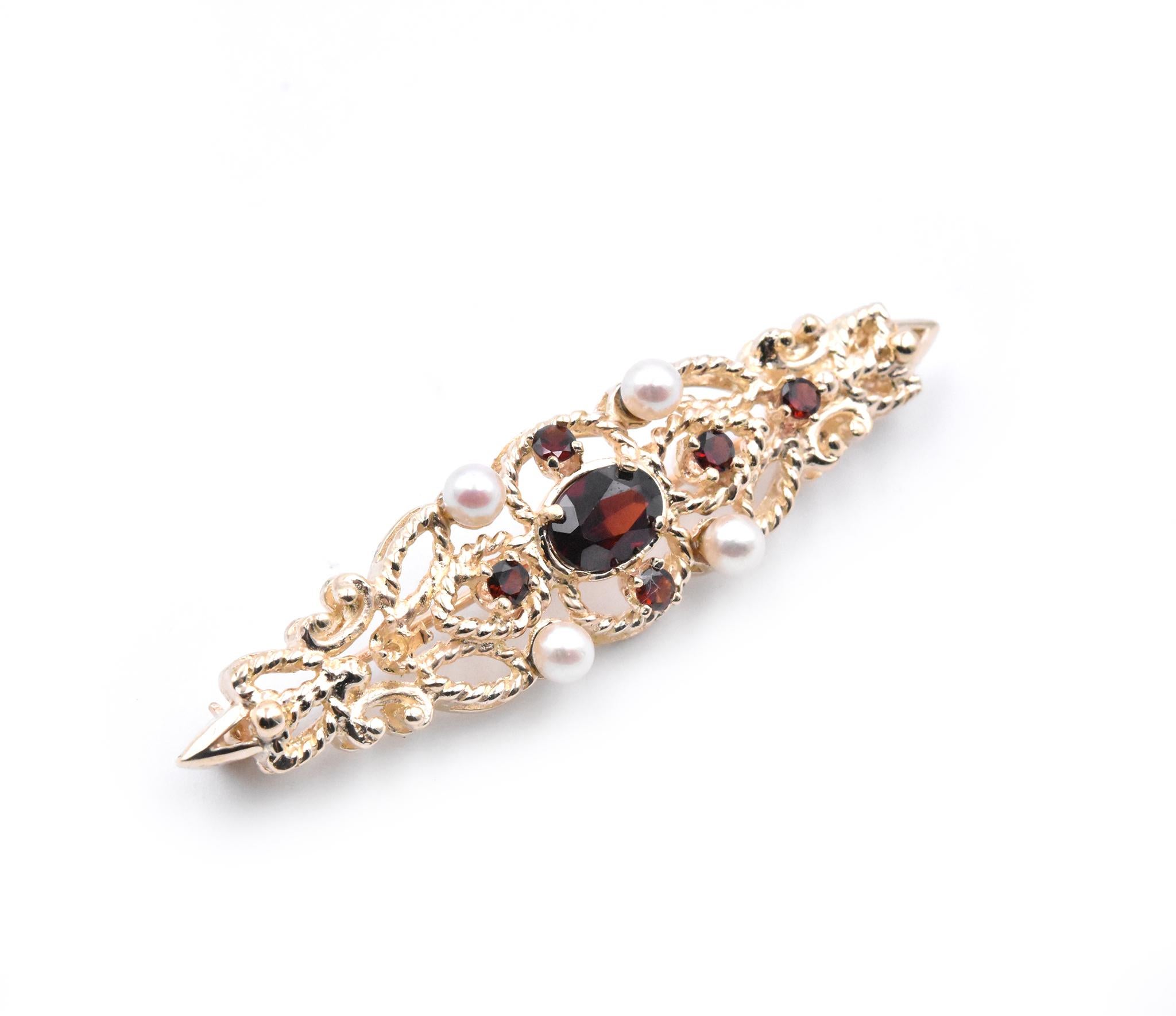 Designer: custom
Material: 14k yellow gold
Gemstone: Garnet = 1 oval cut and 6 round cuts
Dimensions: pin is approximately 52.89mm by 12.95mm
Weight: 7.38 grams
