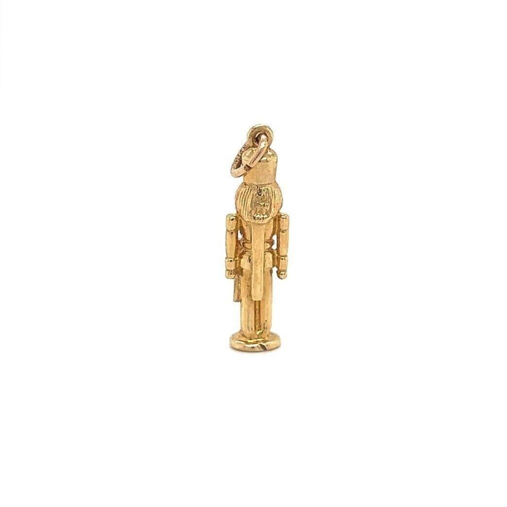 14k Yellow Gold Vintage Nutcracker 3D Holiday Charm or Pendant

Condition:  Excellent Condition, Professionally Cleaned and Polished
Metal:  14k Gold (Marked, and Professionally Tested)
Weight:  3.1g
Length:  1 Inch
Width:  .25 Inches
Thickness:  .2
