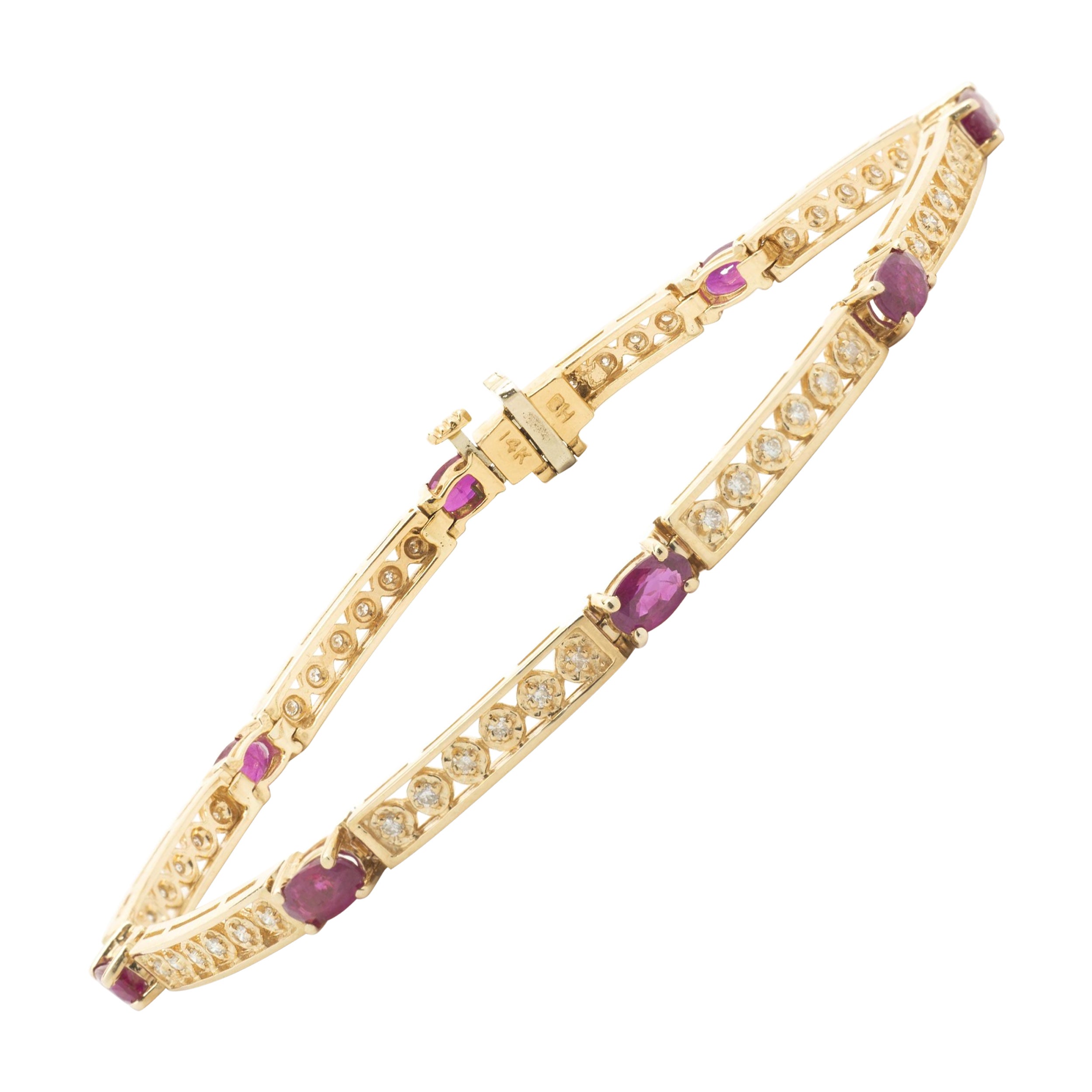 Bracciale tennis in oro giallo 14 carati con rubini e diamanti d
epoca