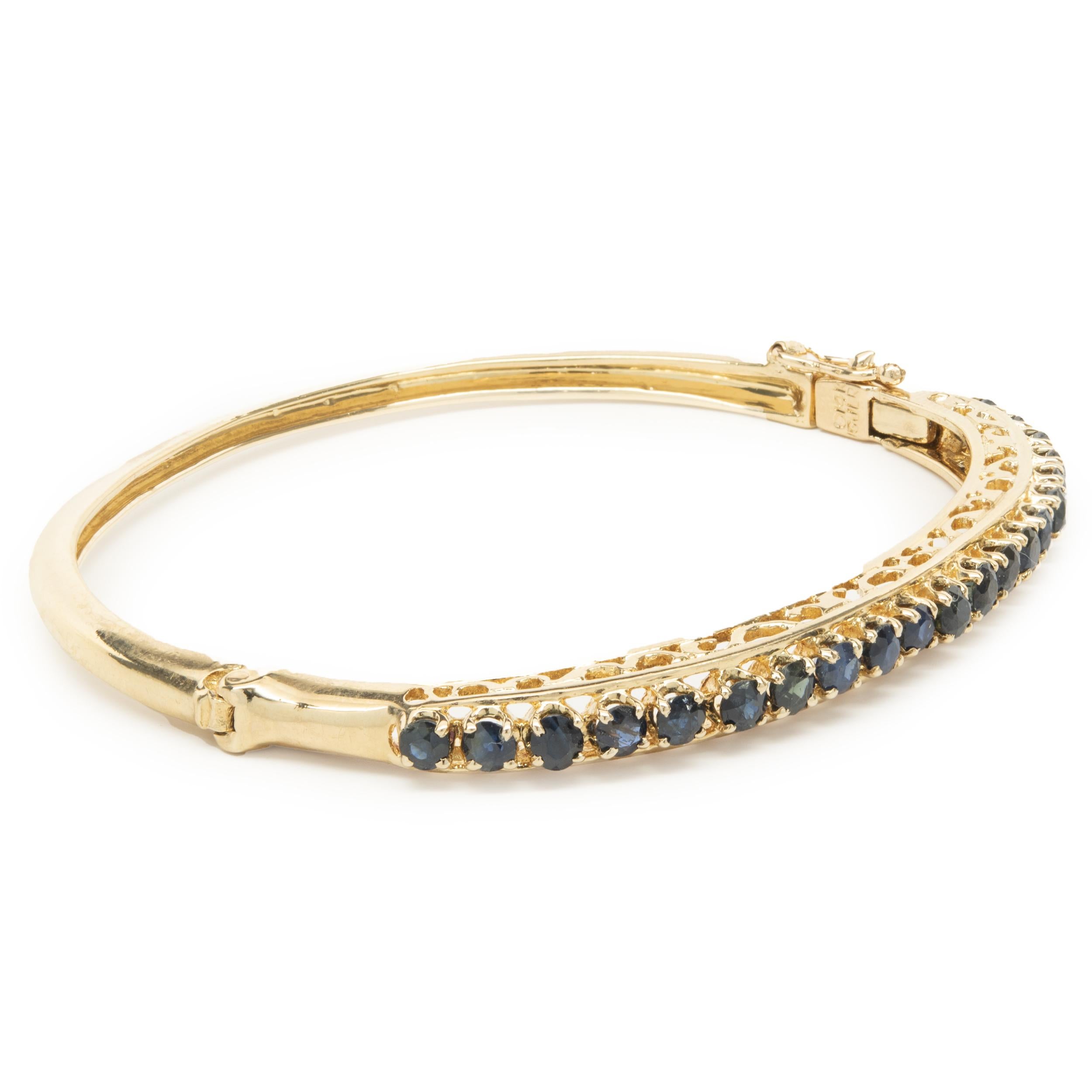 Designer: custom 
Material: 14K yellow gold
Sapphire: 21 round cut = 1.89cttw
Dimensions: bracelet will fit up to a 7-inch wrist
Weight: 15.85 grams