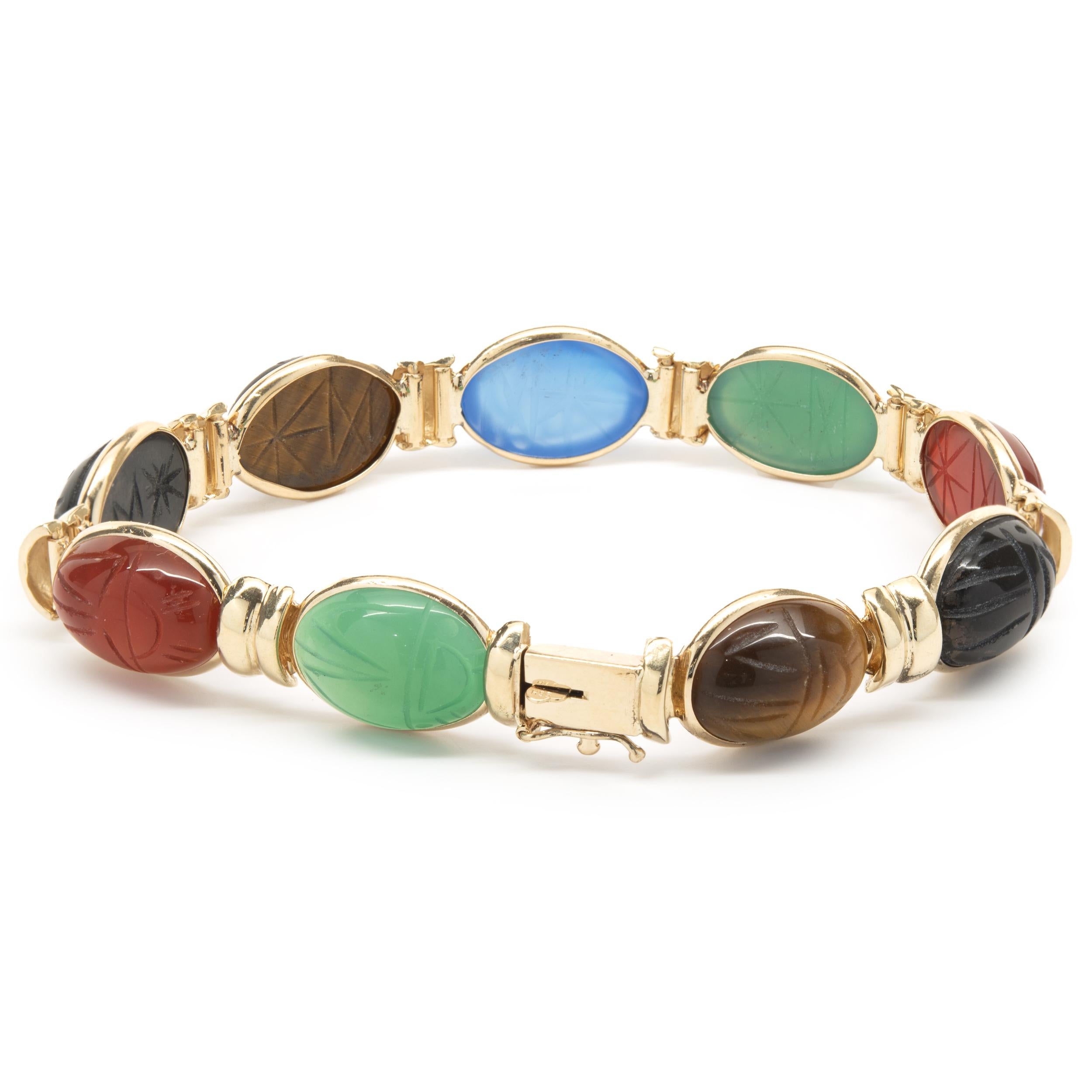 Designer: custom 
Material: 14K yellow gold
Dimensions: bracelet will fit up to a 7-inch wrist
Weight: 19.12 grams