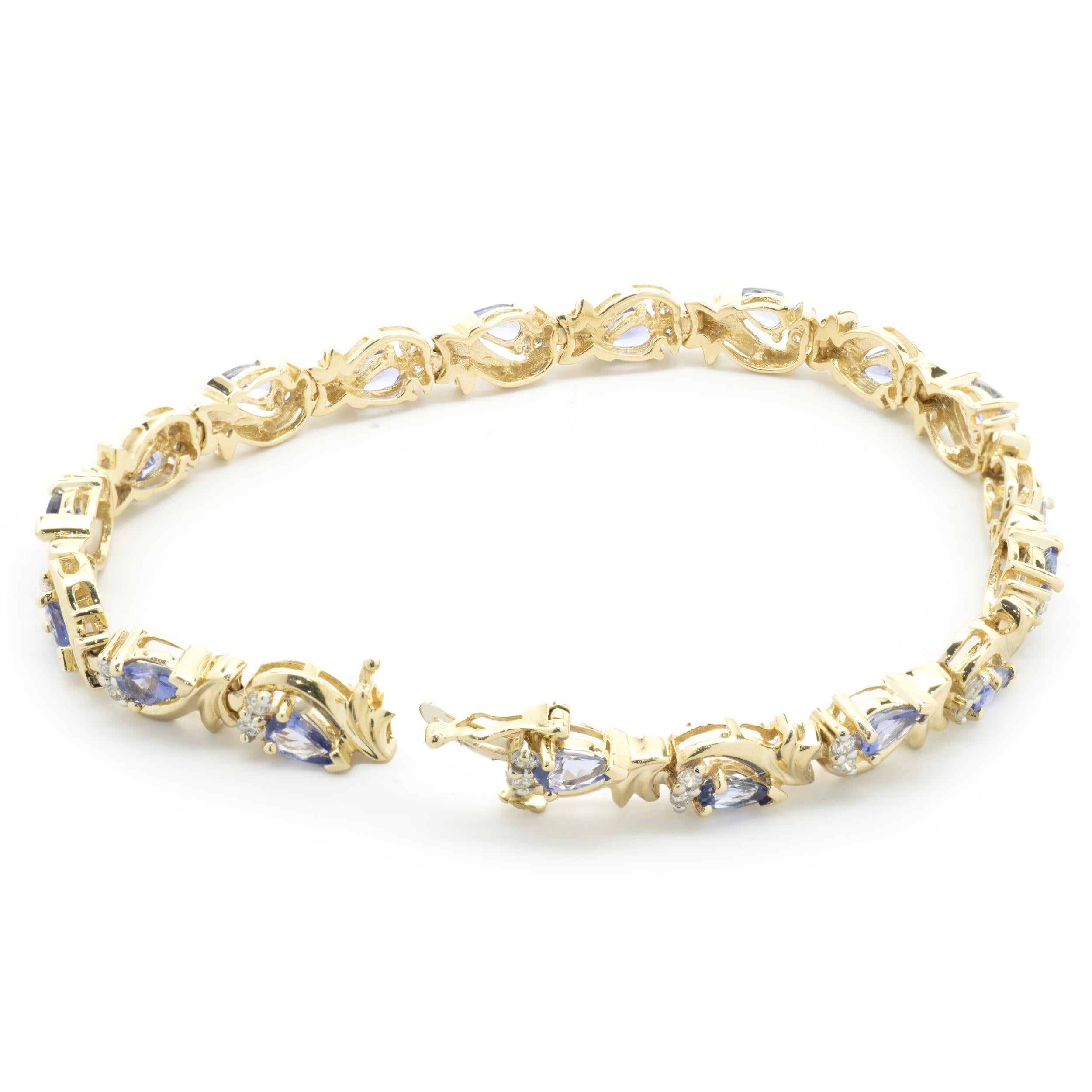 Designer: custom
Material: 14K yellow gold
Diamond: 36 round cut = 0.36cttw
Color: H 
Clarity: SI1
Tanzanite: 18 pear cut = 2.88cttw
Weight:  13.60 grams
Dimensions: bracelet will fit up to a 6.5-inch wrist