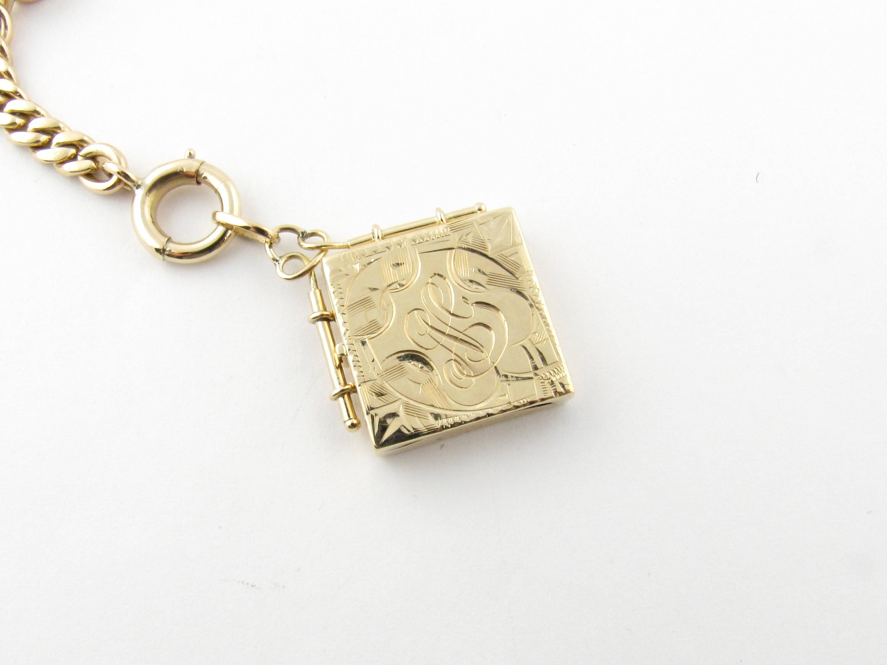 Vintage 14 Karat Yellow Gold Watch Fob Locket

This lovely watch fob features a monogrammed locket (