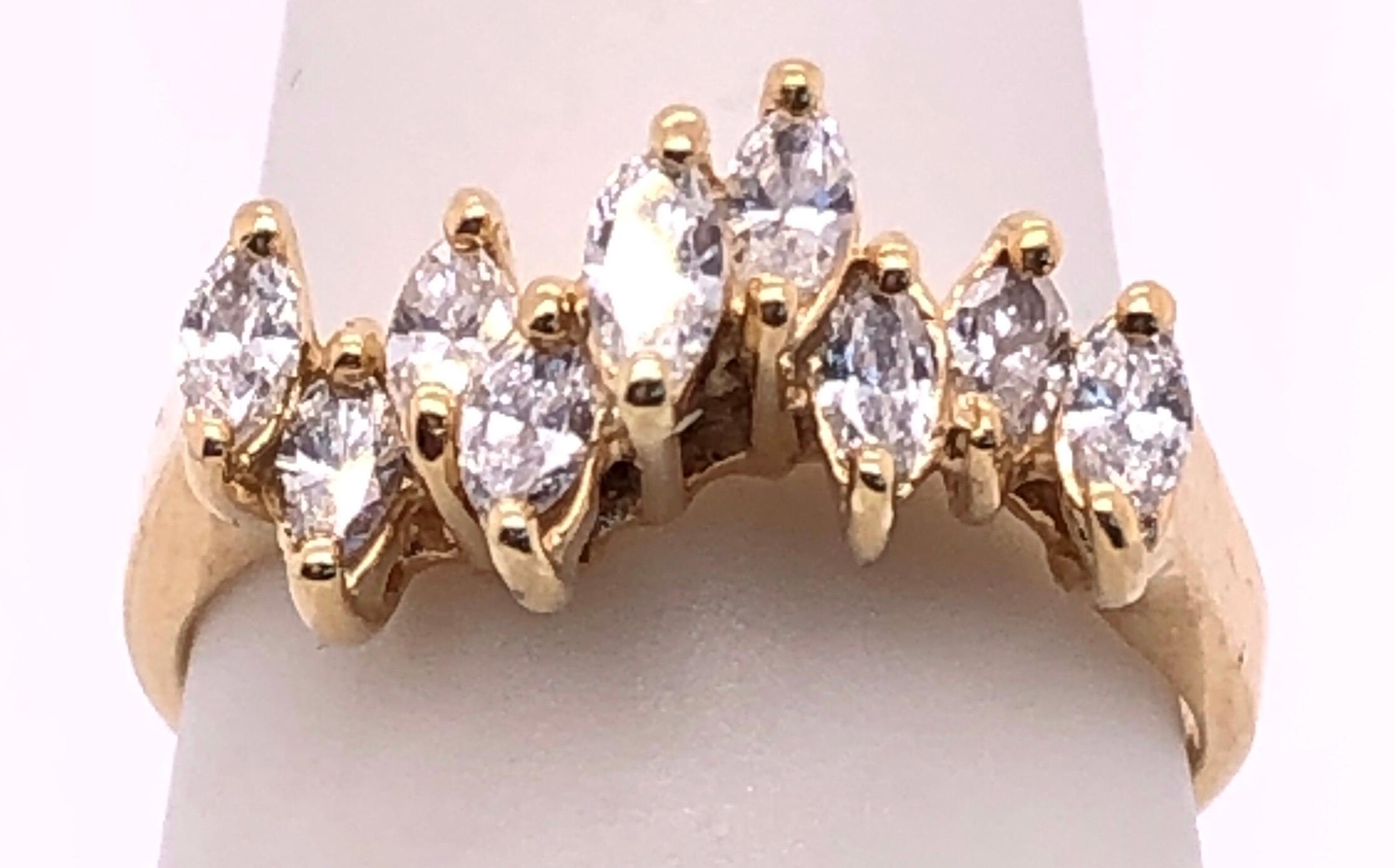 14 Karat Yellow Gold Wedding Bridal Ring with Marquise Diamonds Size 5.
1.00 total diamond weight.
3 grams total weight.