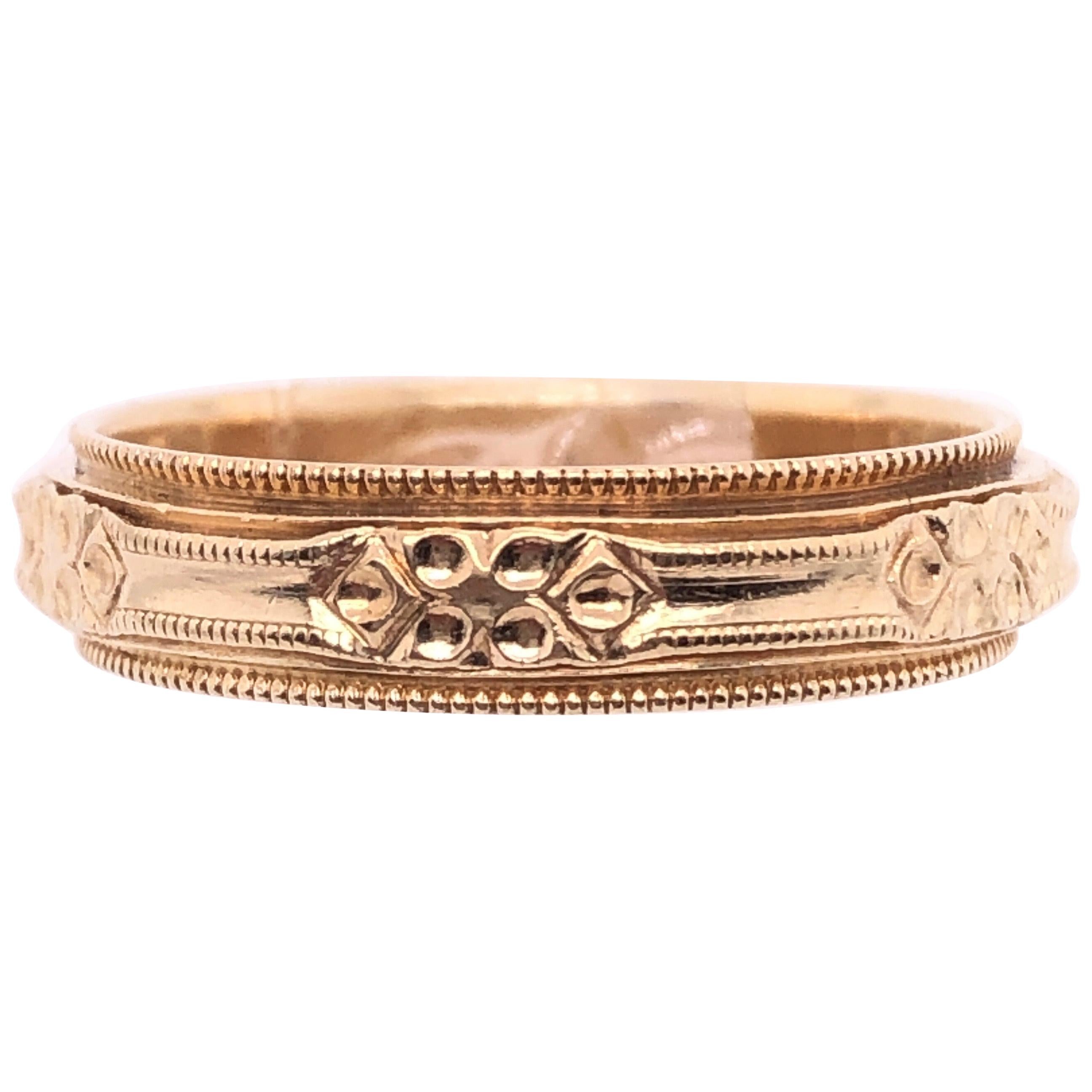 Anneau de mariage en or jaune 14 carats / anneau à design continu en vente