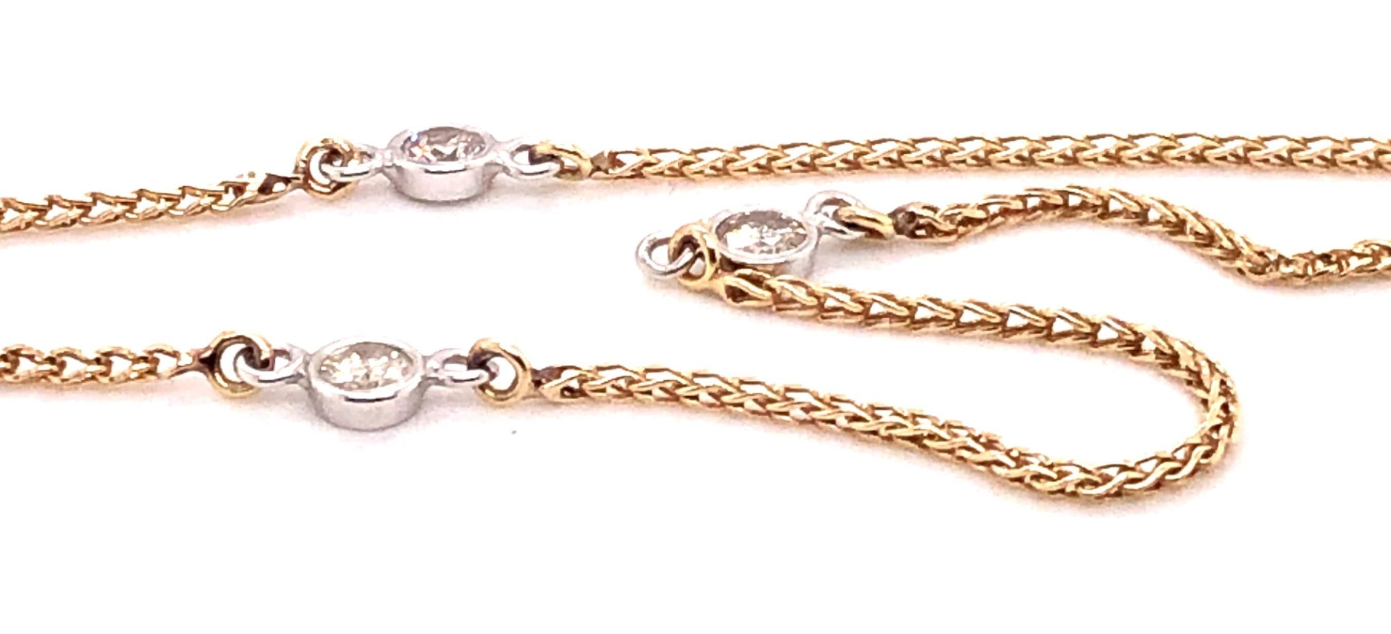 14 Karat Yellow Gold/White Gold necklace with 4 round cut diamonds.

The Diamonds are 1.00 carat weight H-I color and SI1-SI2 clarity.  Each one is approx. 1/8 inch around.

The necklace measures 16 inches.