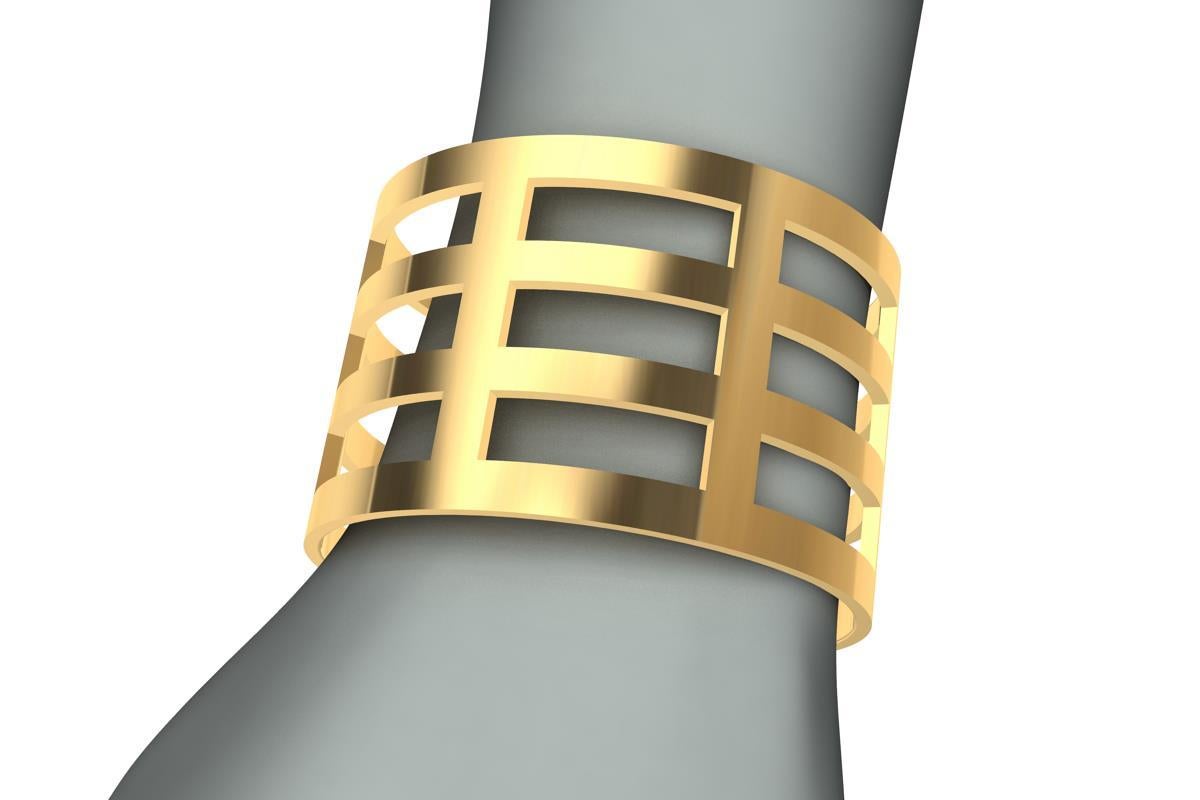 Tiffany designer, Thomas Kurilla designed this after selling original designs to Tiffany's. This wide 18 Karat  Yellow Gold Cuff Bracelet 1 5/8 inch wide and 1.4 mm  thick with fifteen rectangle openings. From my graphic, sculptural, and minimalist