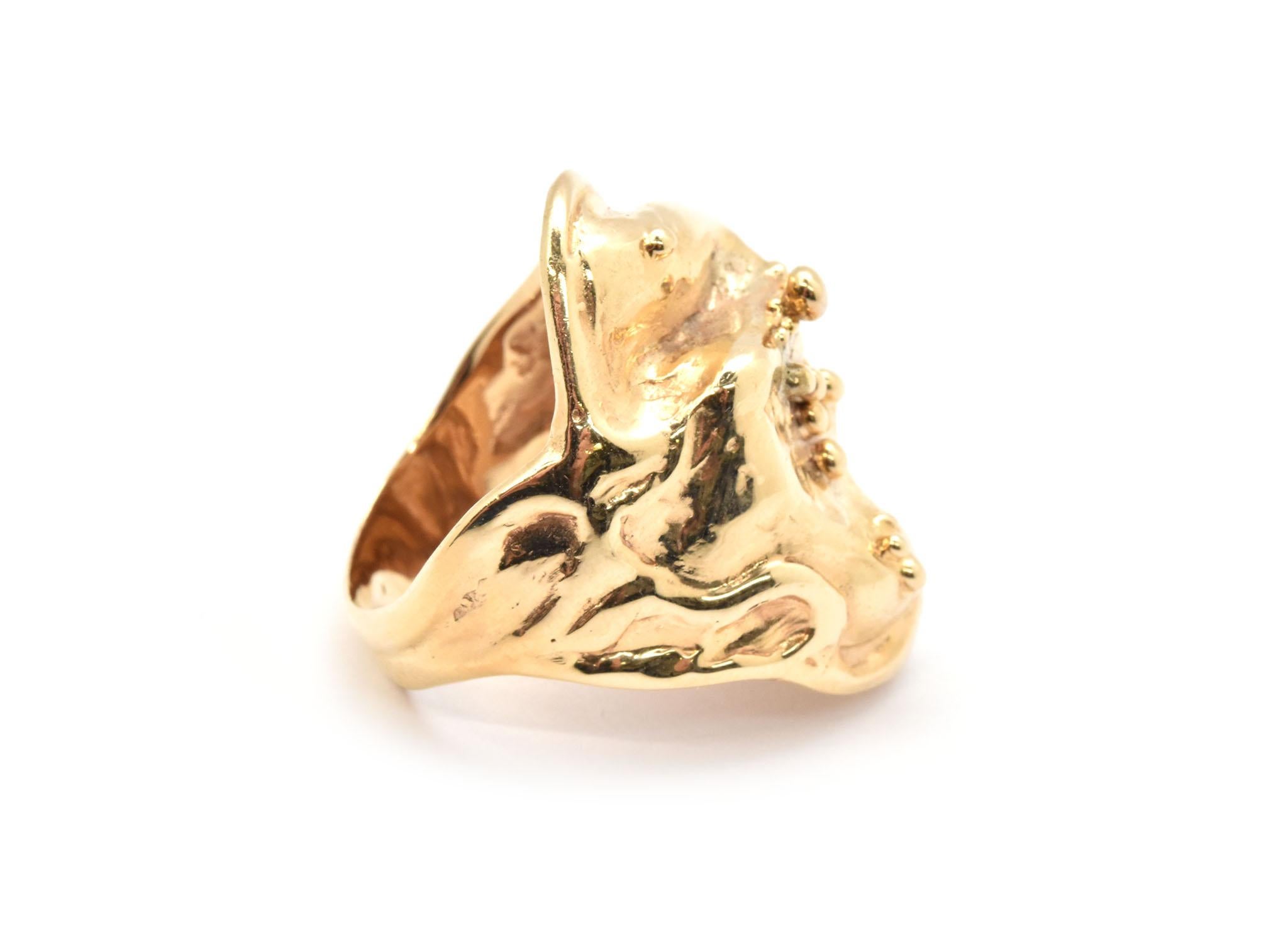 This great chunky funky free-form custom-made ring is made in solid 14k yellow gold. The face of the ring measures 31mm wide and appears to have bubbles. The piece weighs 10.85 grams and is a size 10.