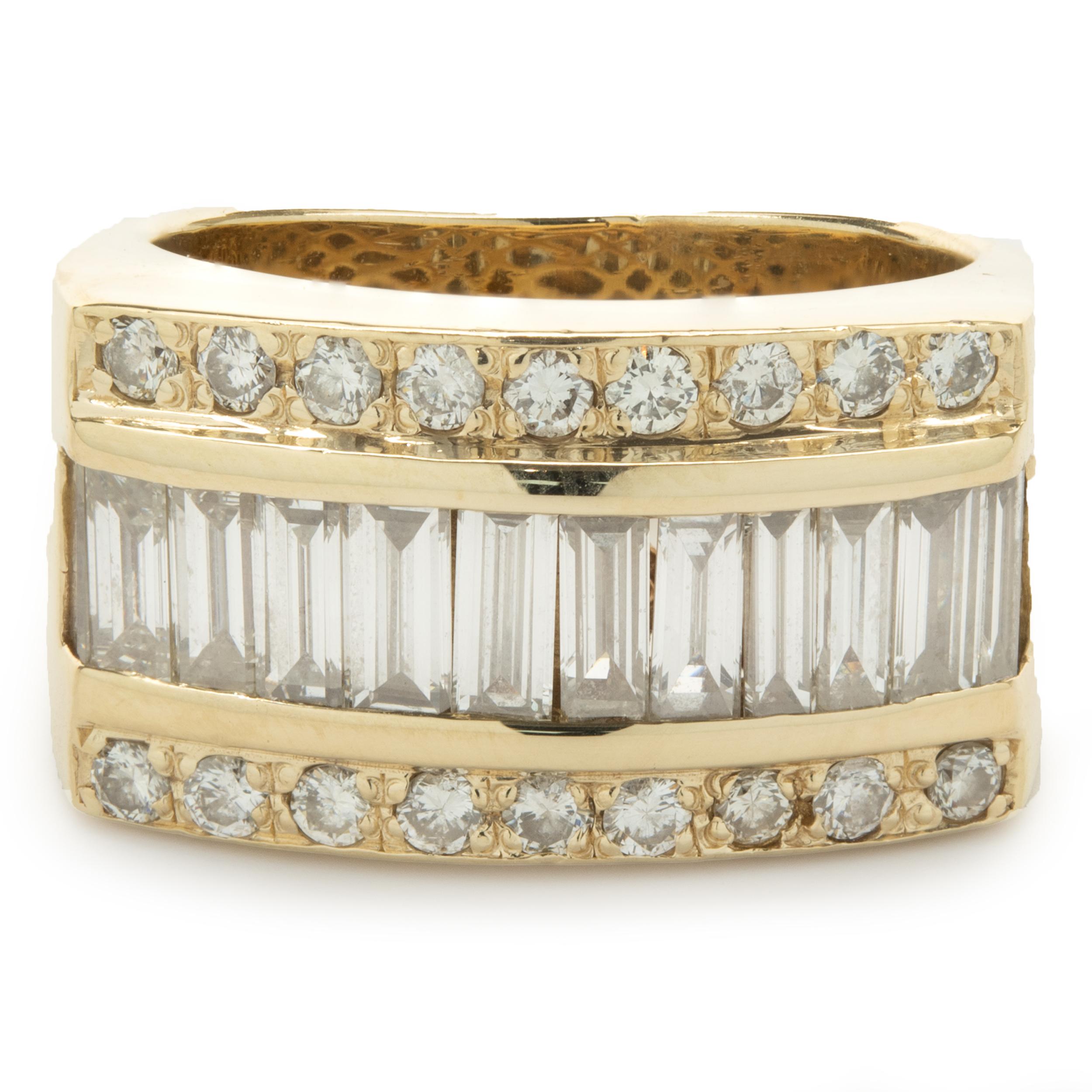 Designer: custom
Material: 14K yellow gold
Diamond: 11 baguette cut = 2.20cttw
Color: H
Clarity: SI1
Diamond: 18 round brilliant cut = .36cttw
Color: H
Clarity: SI1
Ring size: 6.5 (please allow two additional shipping days for sizing