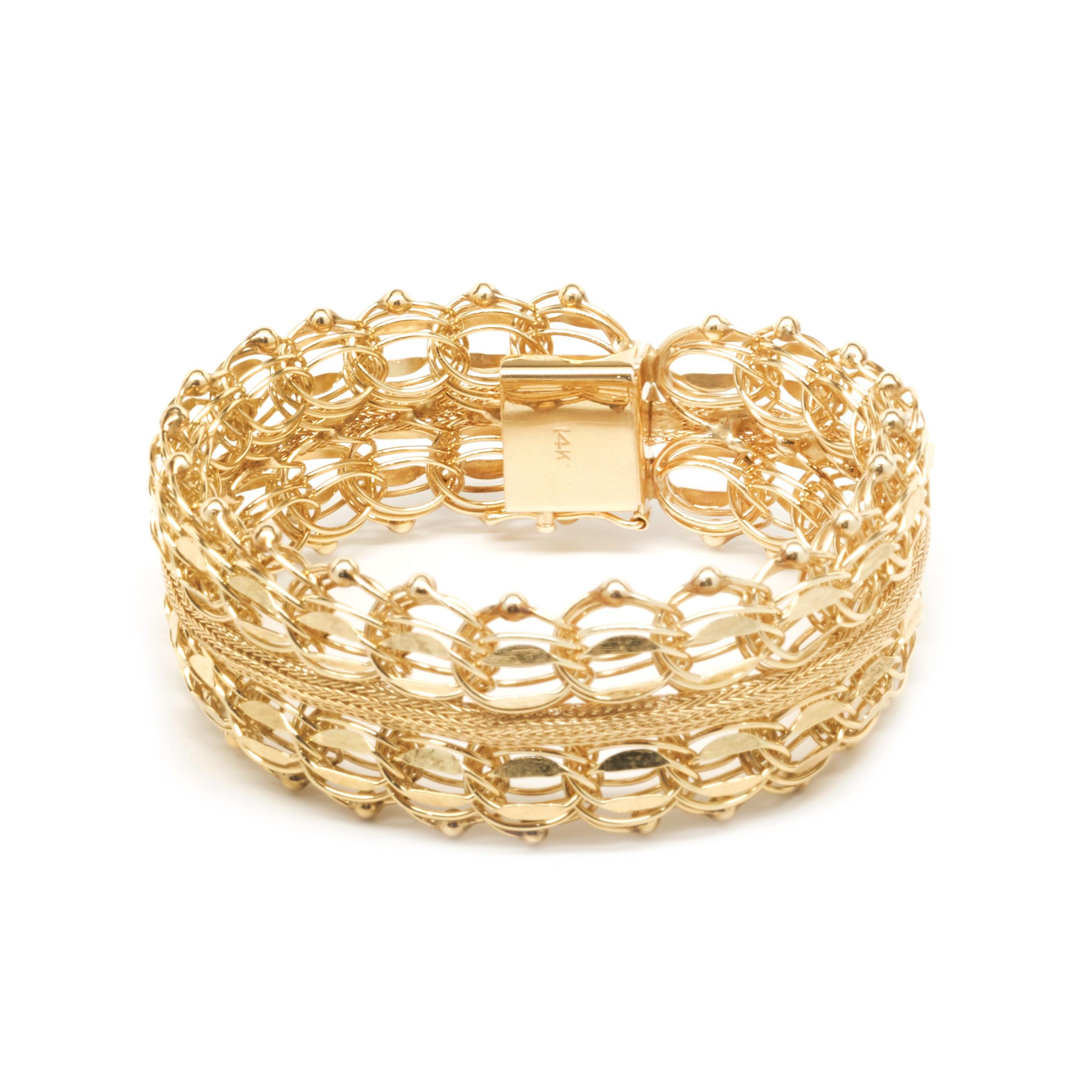 Designer: custom
Material: 14K yellow gold 
Dimensions: bracelet will fit up to a 7-inch wrist
Weight: 38.82 grams
