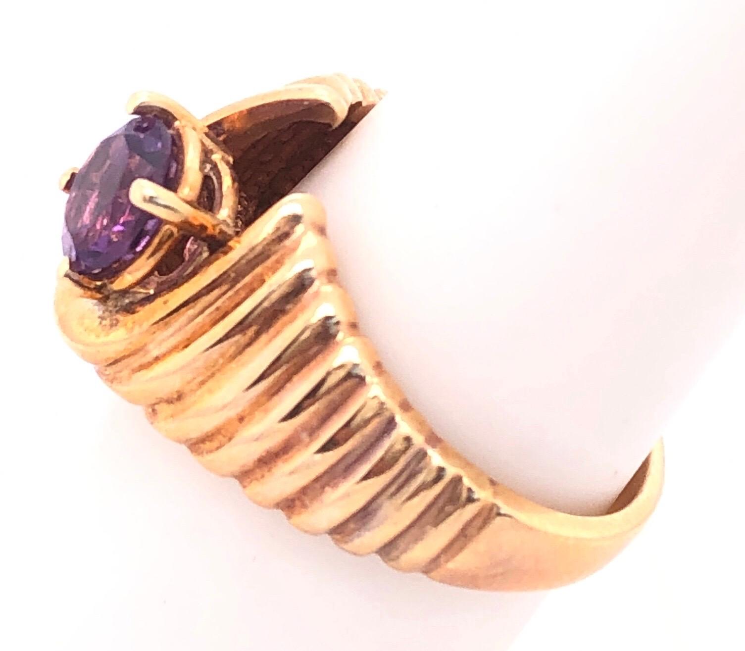 14 Karat Yellow Gold With Center Amethyst Dome Fashion Ring
Size 7
6 grams total weight.