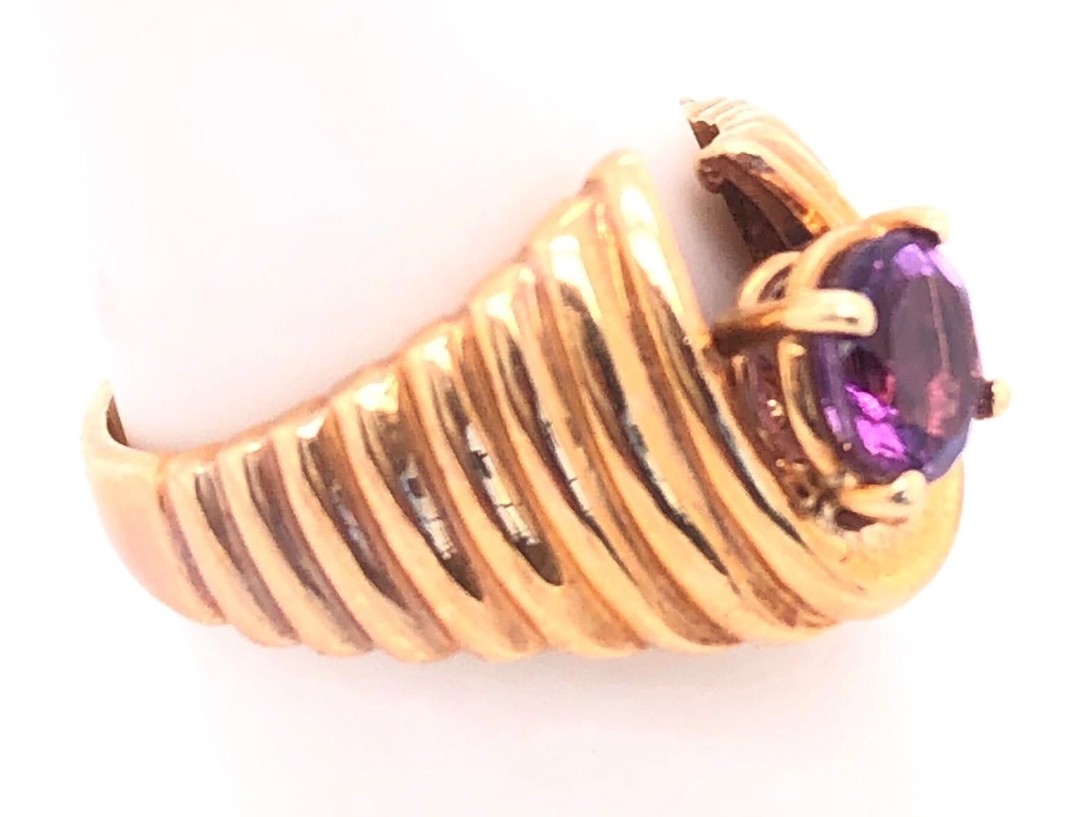 Contemporary 14 Karat Yellow Gold with Center Amethyst Dome Fashion Ring For Sale