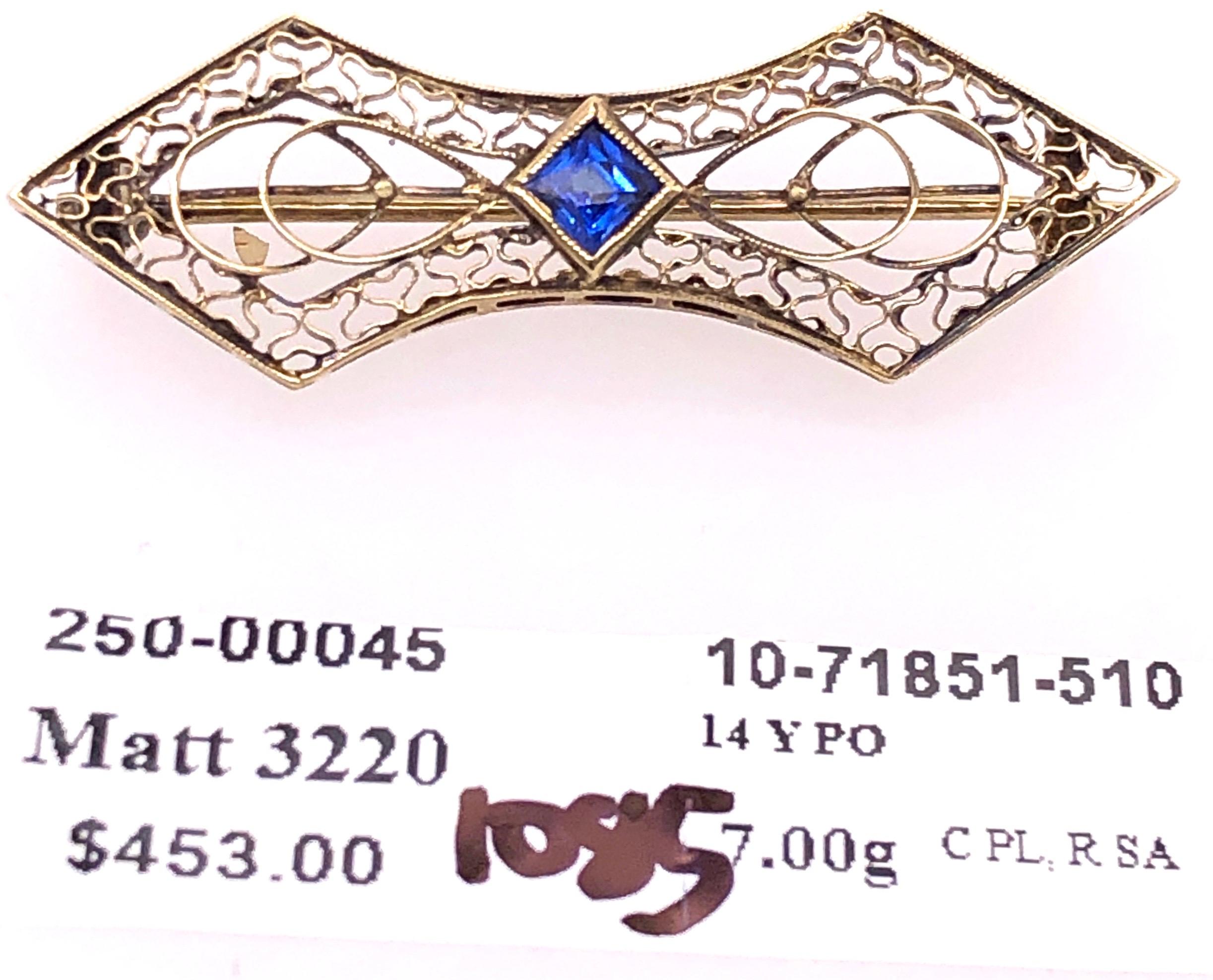 14 Karat Yellow Gold With Sapphire Center Stone Filigree Brooch
7 grams total weight.