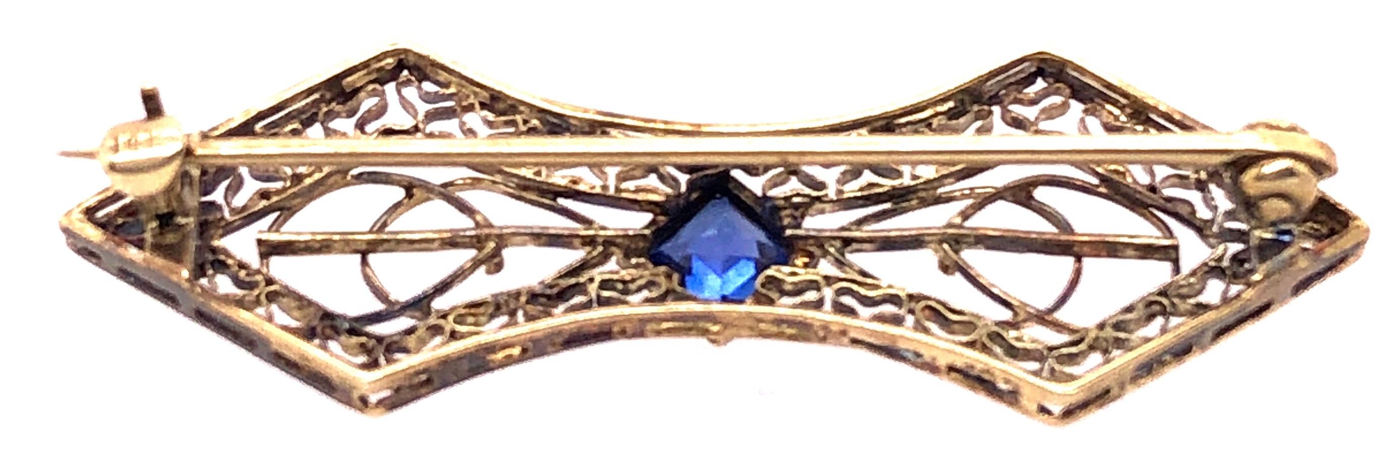 Contemporary 14 Karat Yellow Gold with Sapphire Center Stone Filigree Brooch For Sale