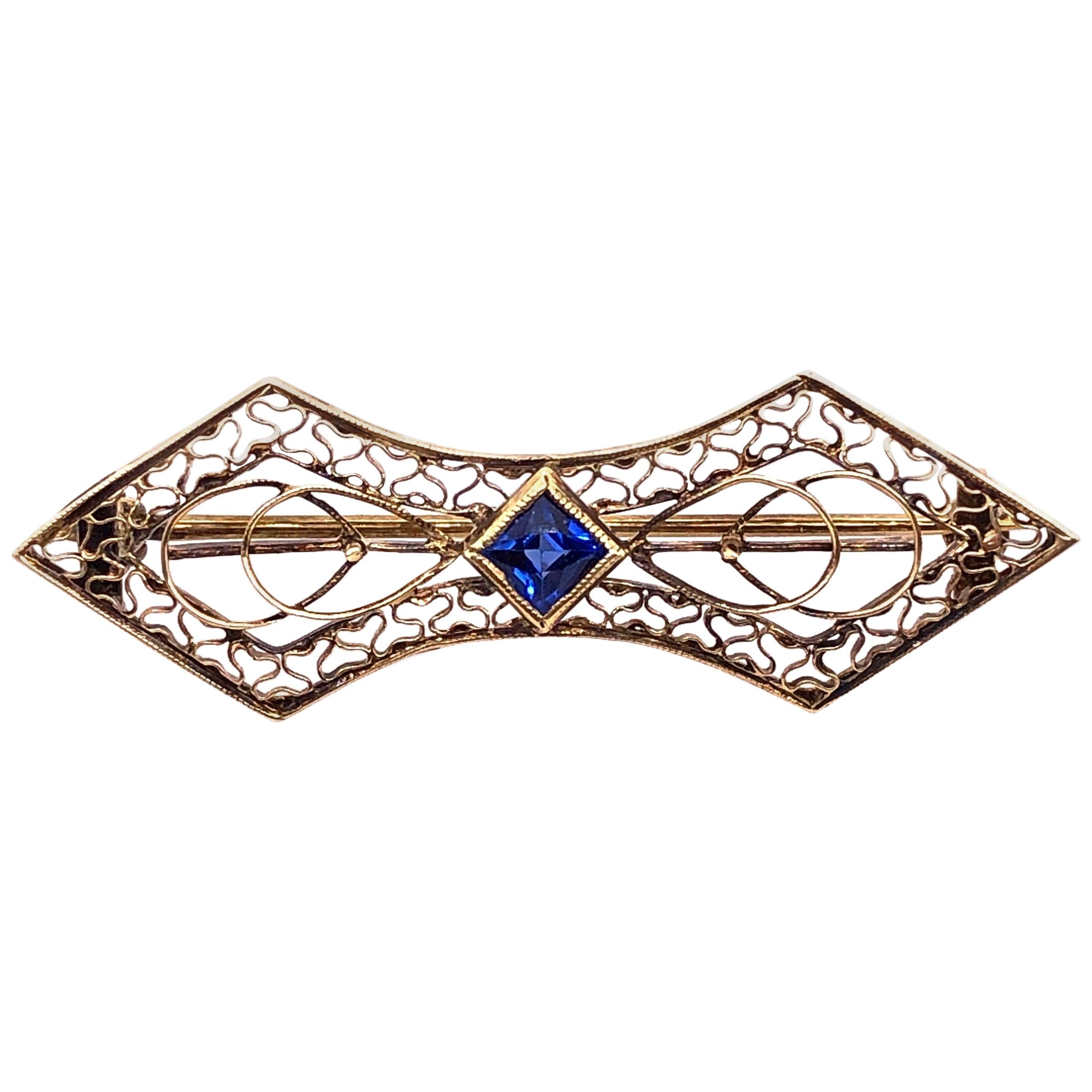 14 Karat Yellow Gold with Sapphire Center Stone Filigree Brooch For Sale