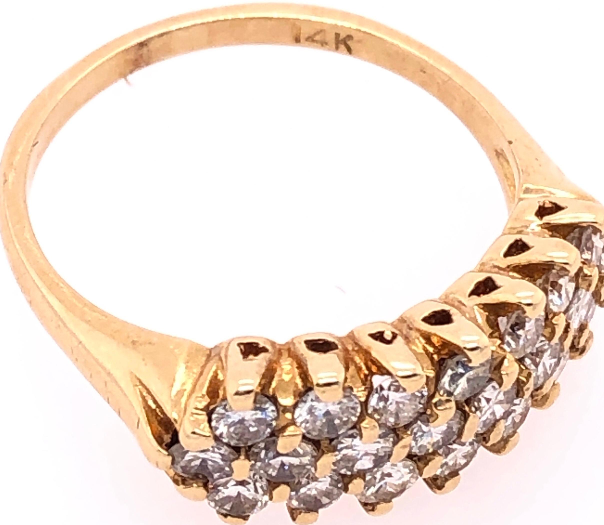 14 Karat Yellow Gold With Triple Tier Diamonds Wedding / Anniversary / Cocktail Ring 
1.50 total diamond weight.
size 7
3 grams total weight.