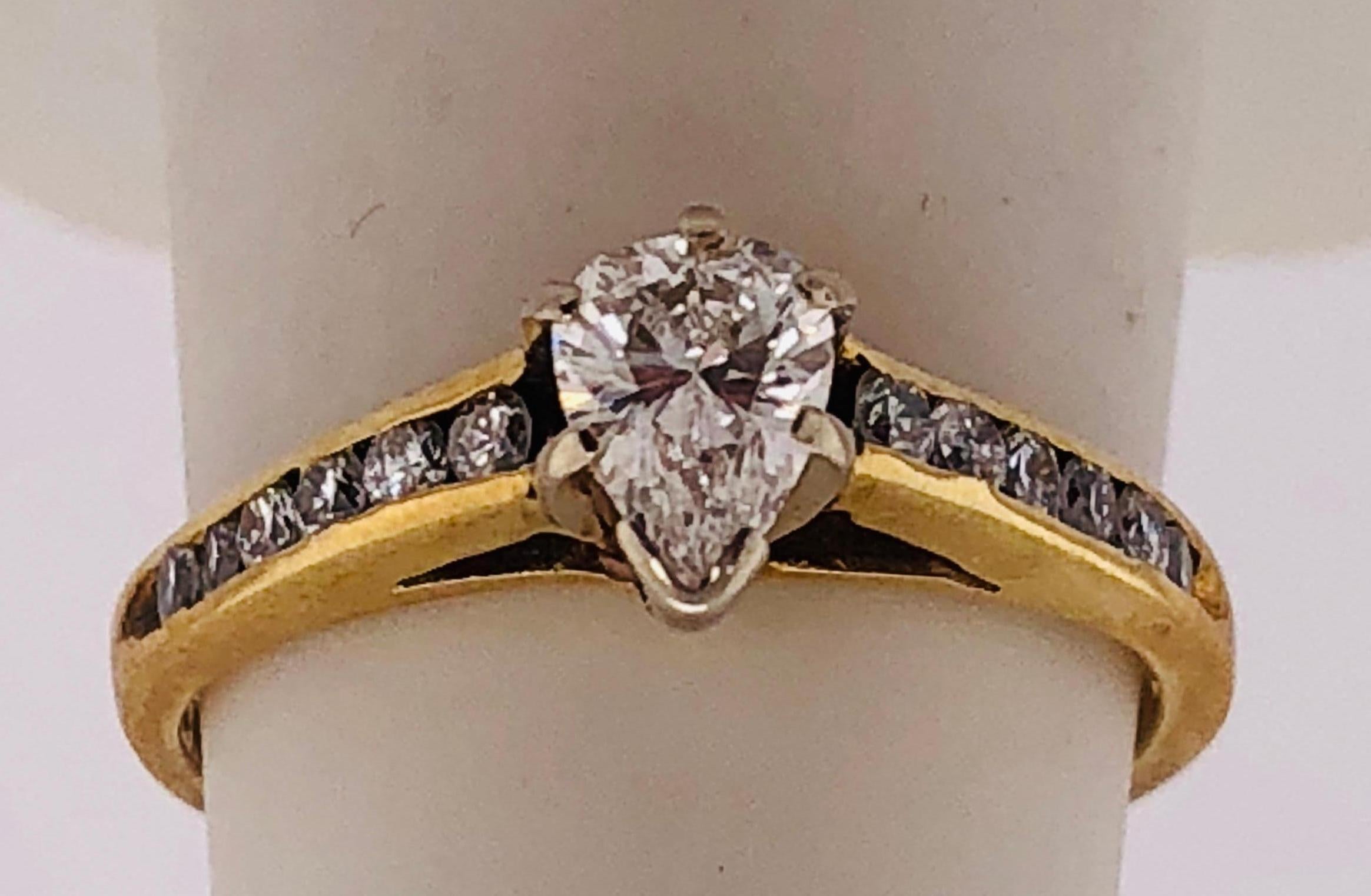 yellow gold engagement ring with white gold prongs