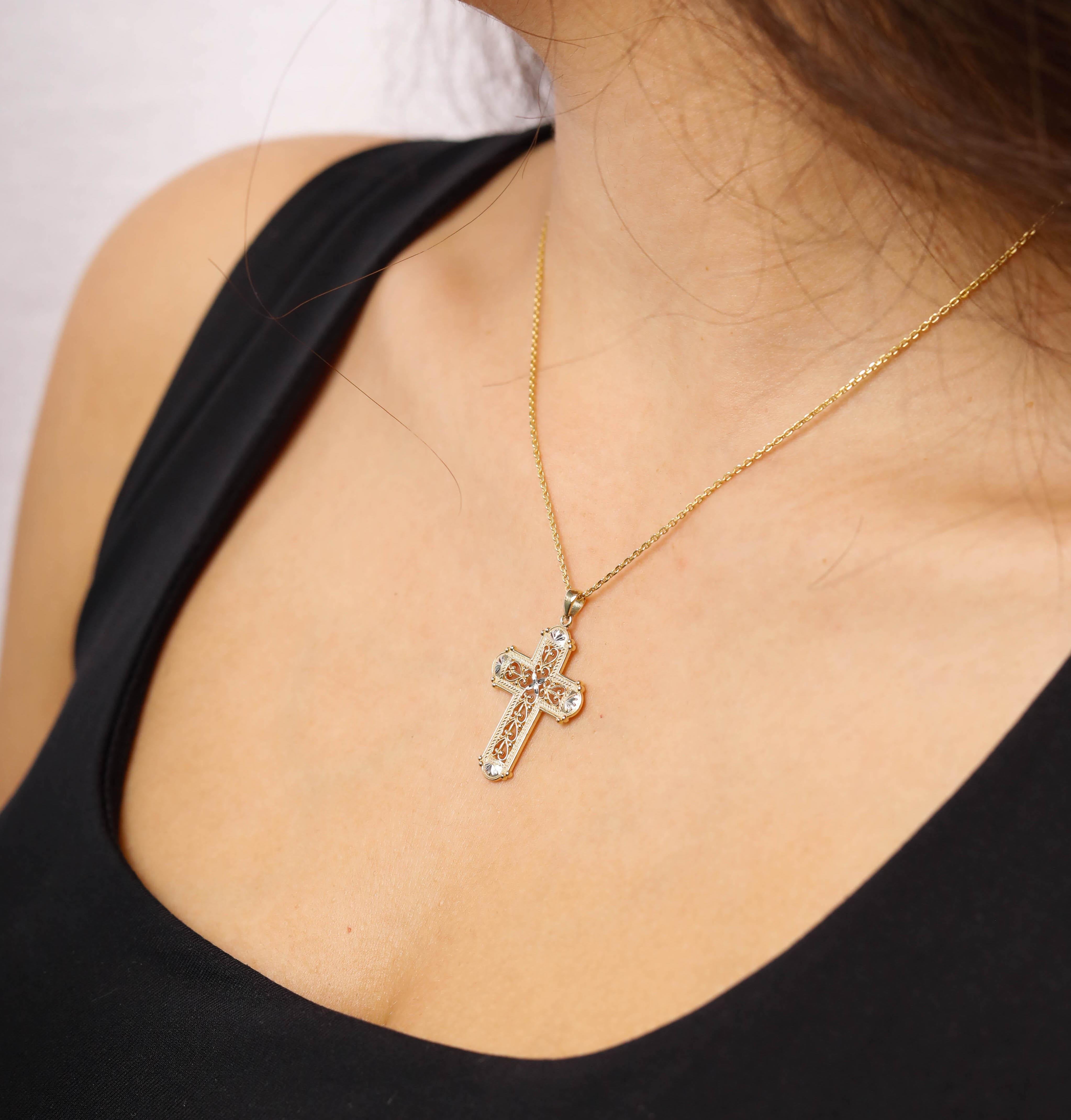 2.2 Grams 14 Karat Yellow Gold Intricate Cross Solid Gold Pendant

These delicate cross pendants are crafted in solid 14 karats yellow gold. Modeled after traditional jewelry, these pendants are with cross Design take on the classic gold