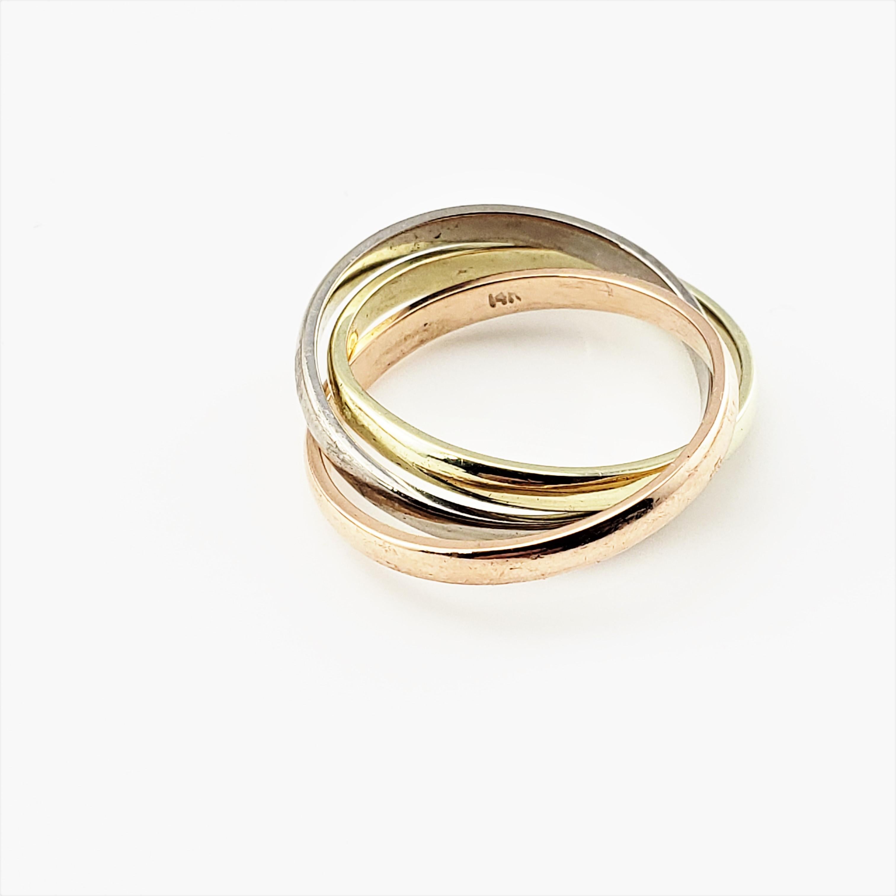 Vintage 14 Karat Yellow, White and Rose Gold Three Band Rolling Ring Size 6.25-

This lovely ring features three interlocking unfixed bands in elegant 14K yellow, rose, and white gold.  Width:  2 mm each band.

Size: 6.25

Weight:  2.8 dwt. /  4.5